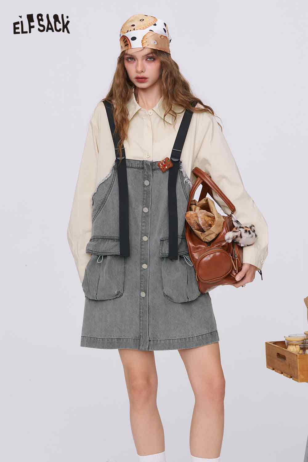 ELFSACK denim color-block midi dress features button front pockets and adjustable black straps over cream blouse