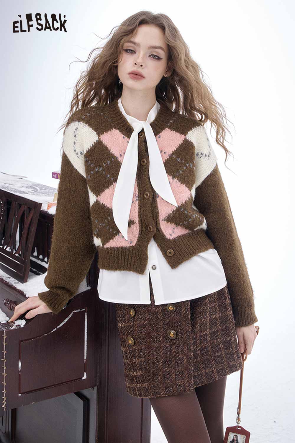 ELFSACK diamond graphic cropped sweater in brown with pink and cream patterns, styled with a white shirt.