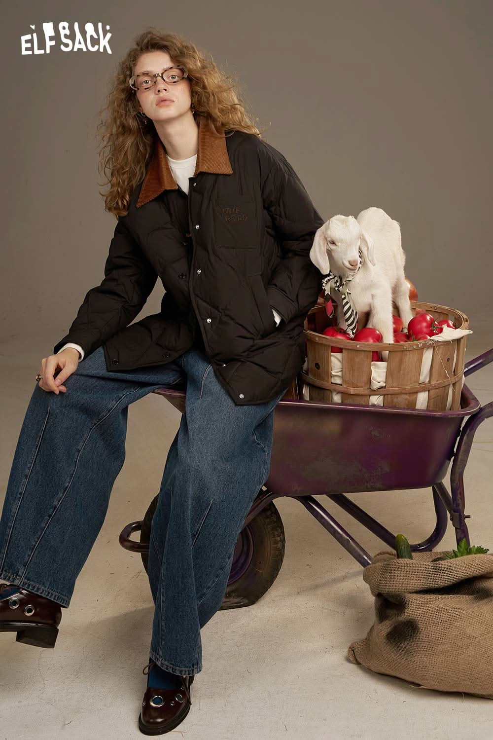 ELFSACK diamond quilted down coat in black, styled with wide-leg jeans and a playful setting