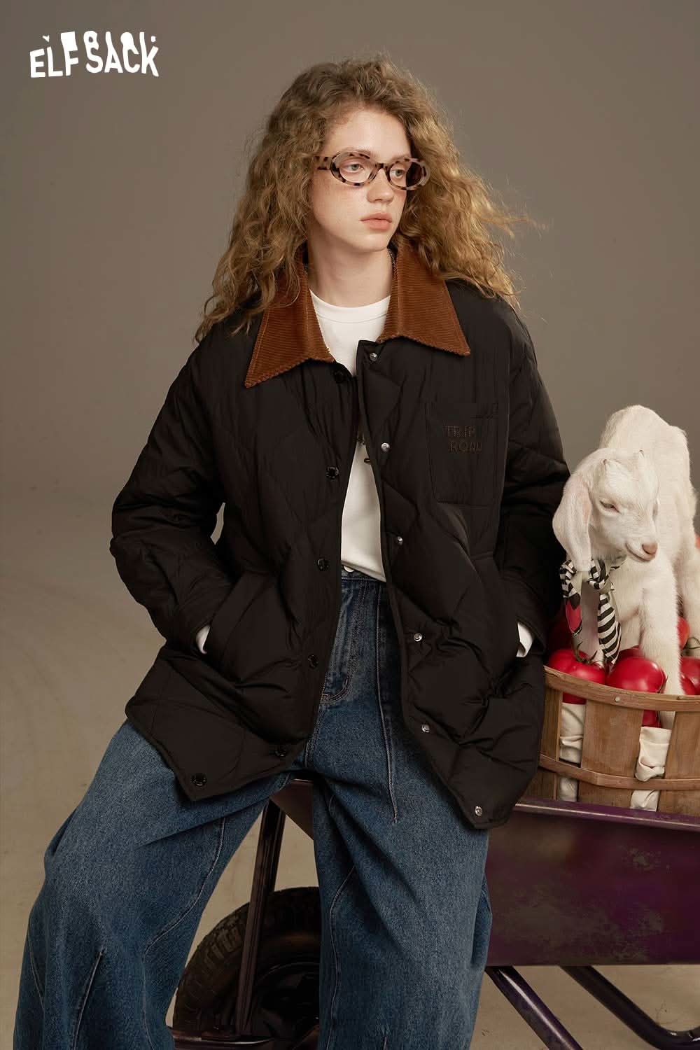 ELFSACK diamond quilted down coat with a brown collar, styled with jeans and glasses
