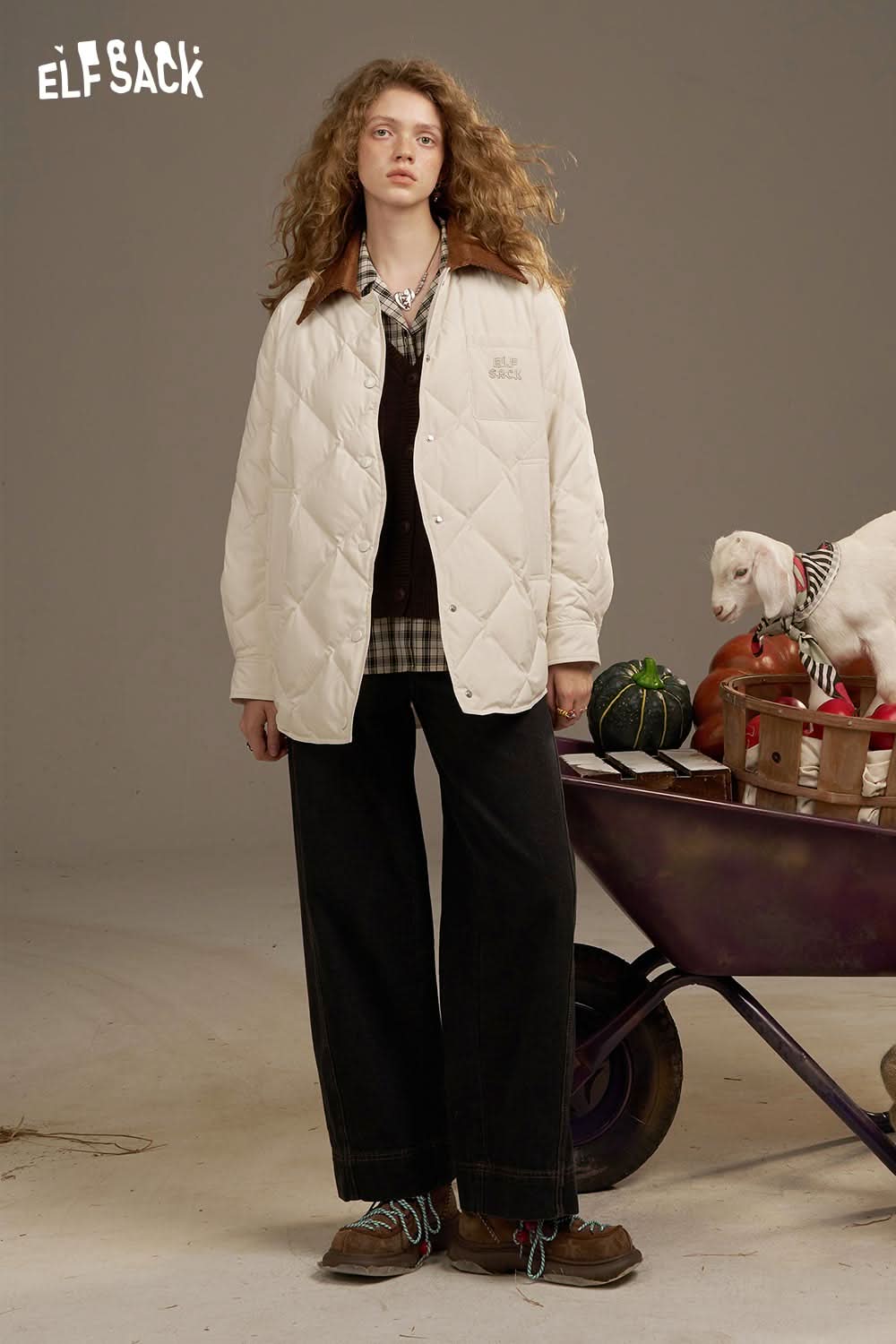 ELFSACK diamond quilted down coat in cream, styled with relaxed fit pants and a casual layered look