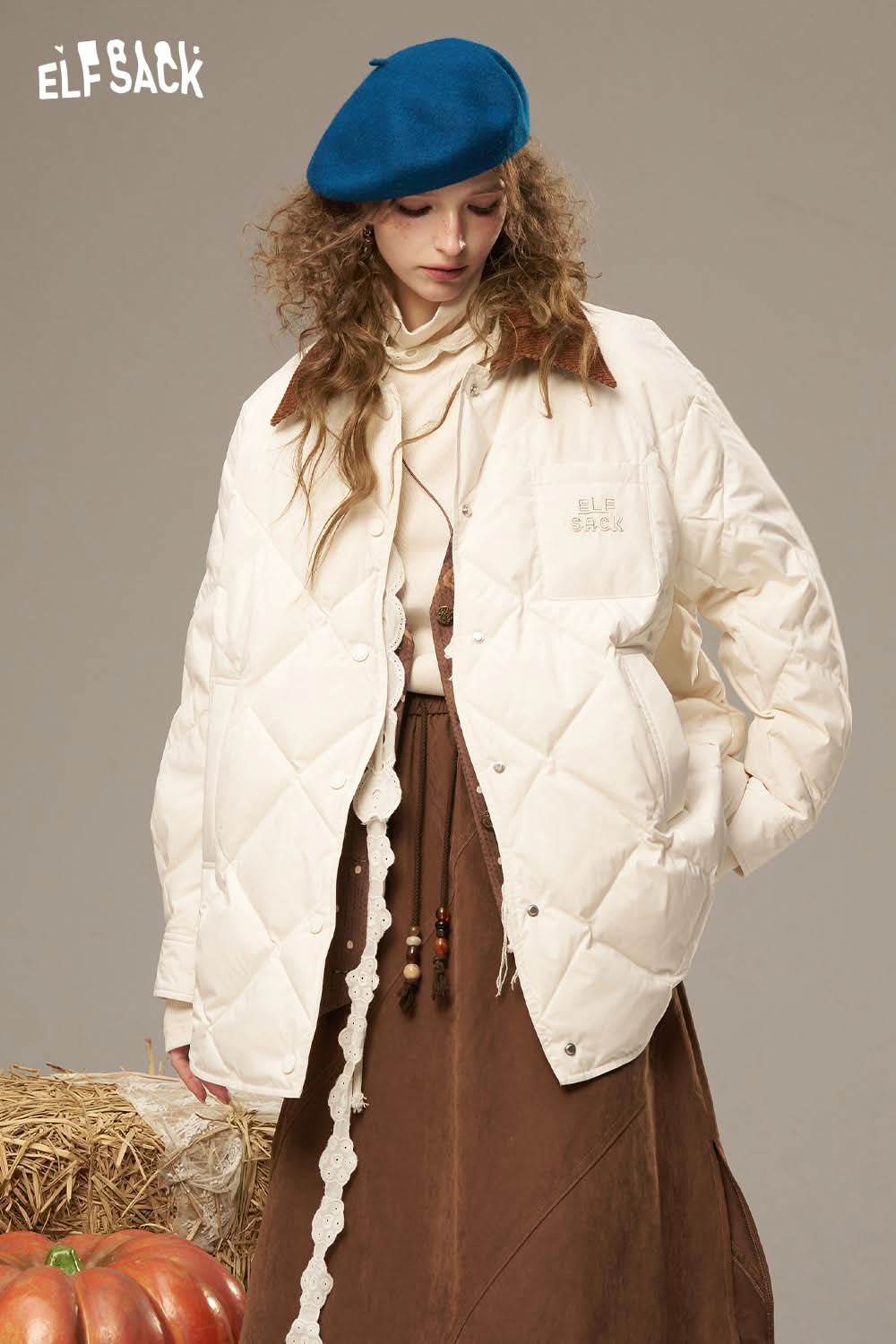 ELFSACK diamond quilted down coat in cream color, featuring a relaxed fit and stylish design