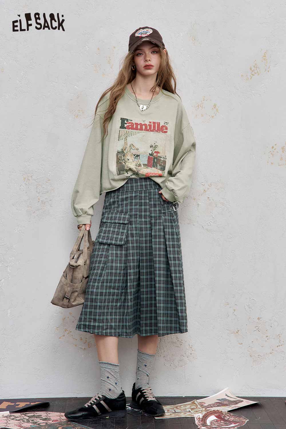 ELFSACK distressed cotton jersey long sleeve tee styled with a plaid skirt and accessories