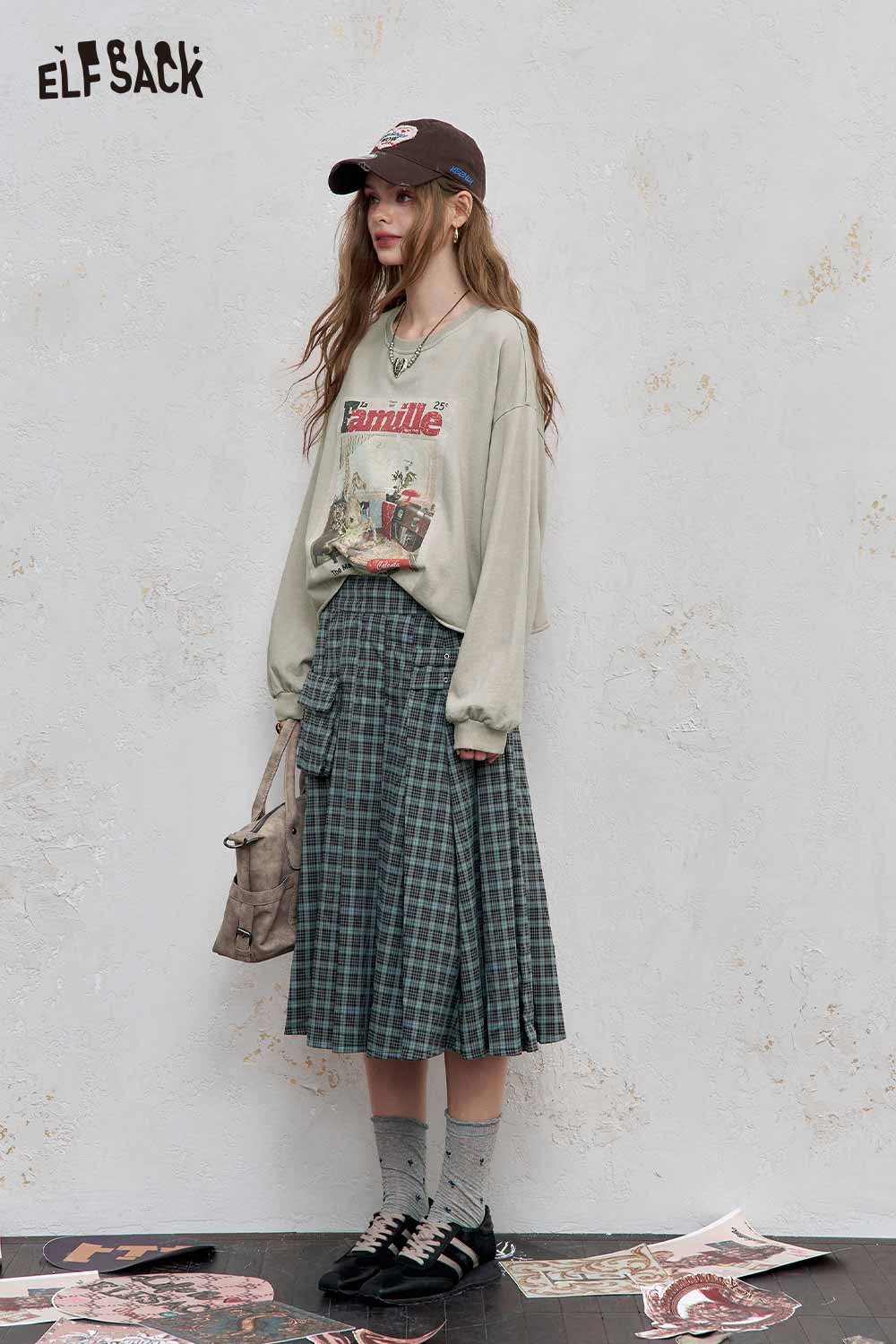 ELFSACK distressed cotton jersey long sleeve tee styled with a plaid skirt and accessories for a casual look
