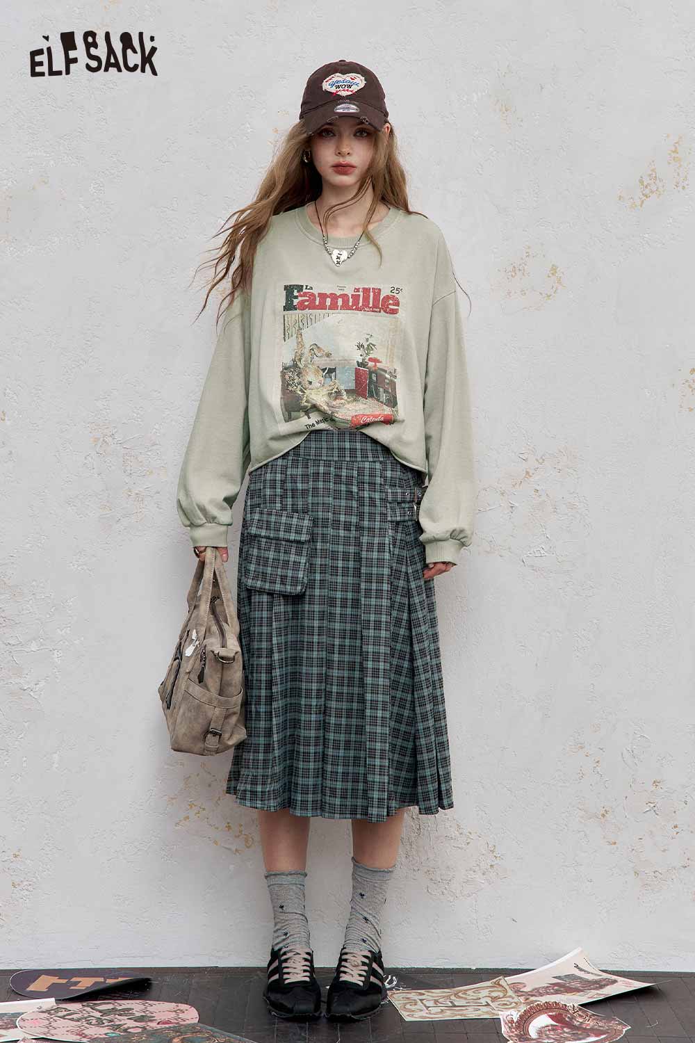 ELFSACK distressed cotton jersey long sleeve tee styled with a plaid skirt and accessories for a trendy look