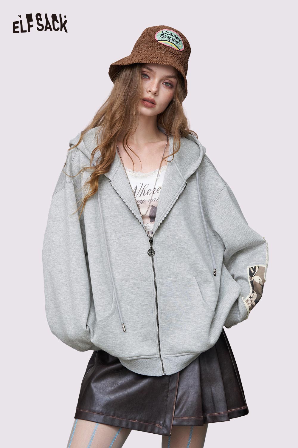 ELFSACK model wearing a light gray distressed zip up hoodie for women with oversized fit and hood