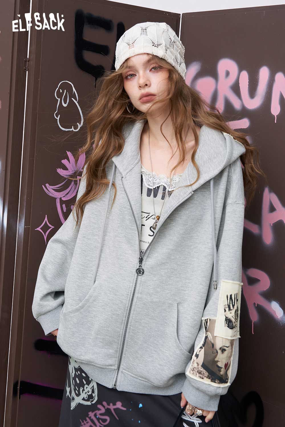 ELFSACK distressed zip up hoodie for women in oversized gray with hood pockets and sleeve patches