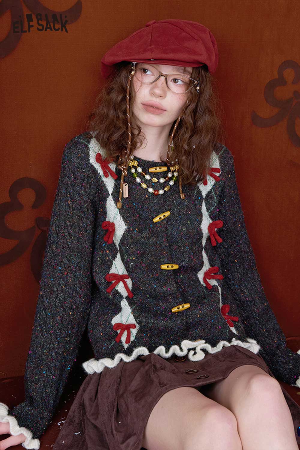 ELFSACK double breasted bow sweater featuring vibrant colors and decorative bows for a stylish look