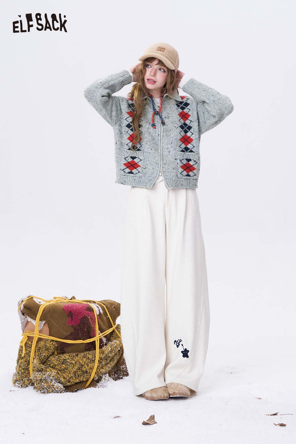 ELFSACK double breasted quilted knit cardigan in gray with colorful patterns, styled with wide-leg pants