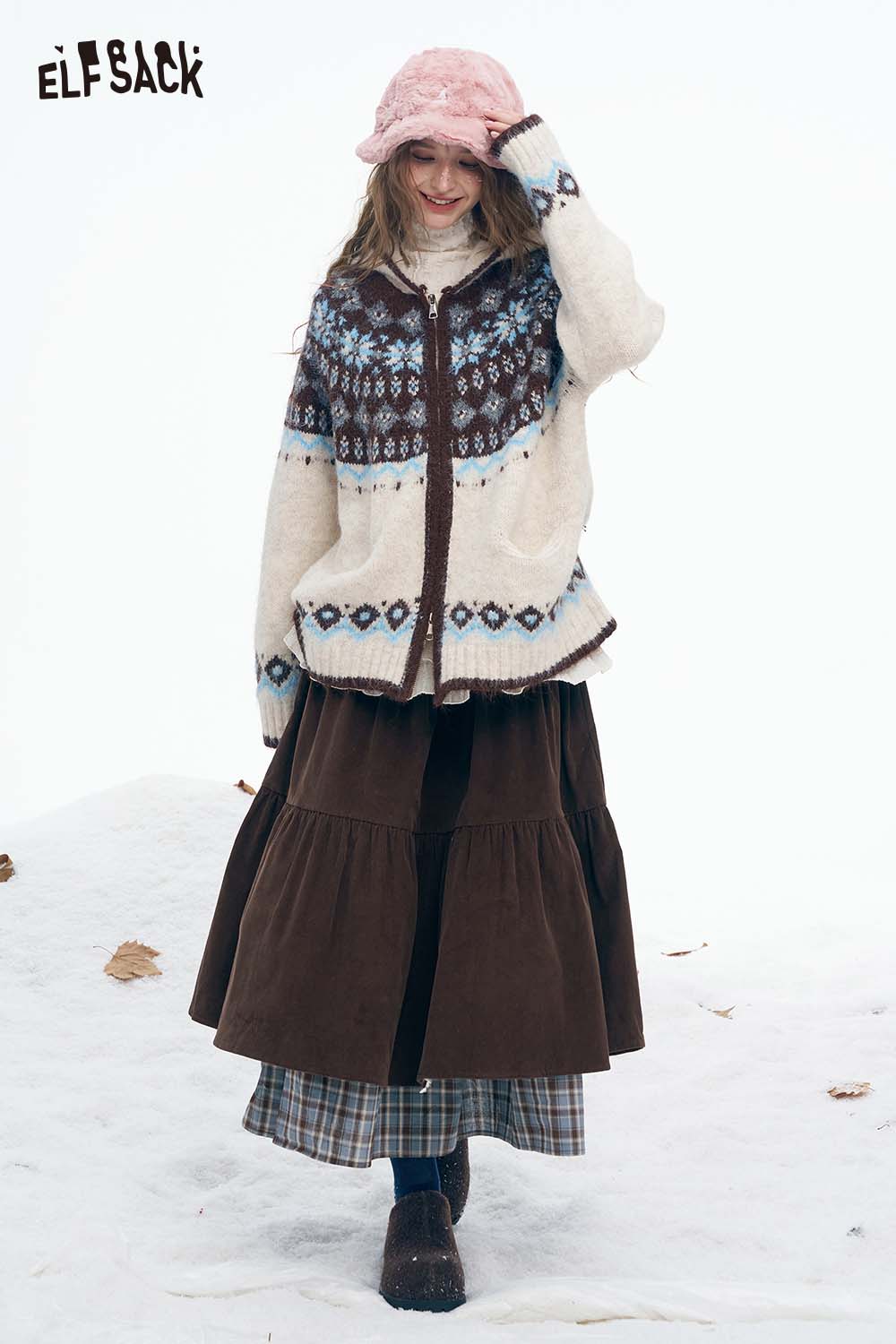 Stylish ELFSACK double layer long skirt for women paired with cozy winter sweater in a snowy setting