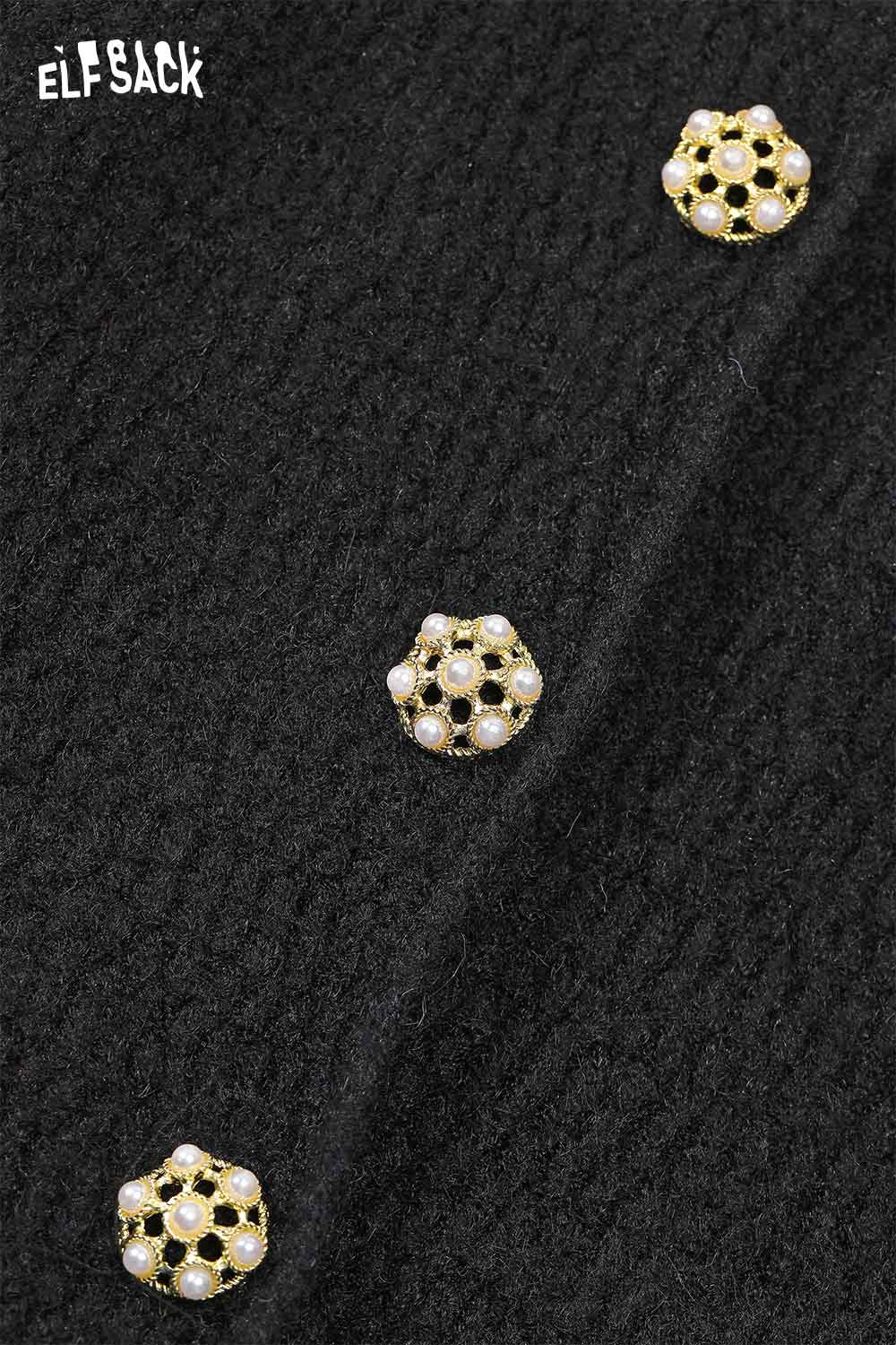 Close-up of elegant gold button dress detailing with decorative buttons on a black fabric