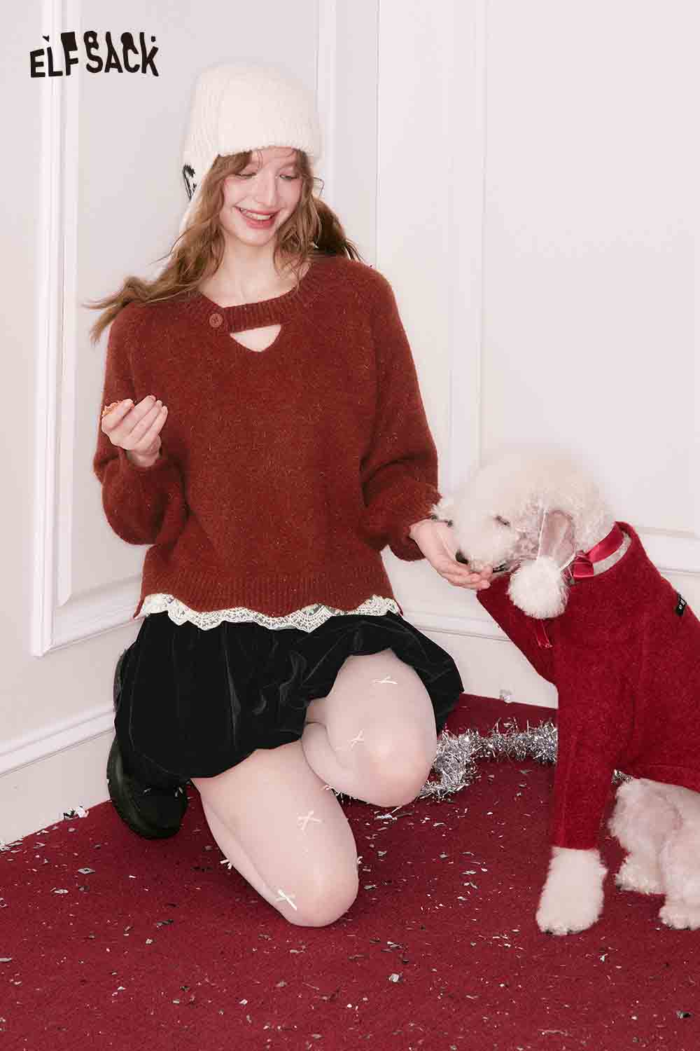 ELFSACK elegant lace trim sweater in rust color paired with a black skirt, styled with a playful dog