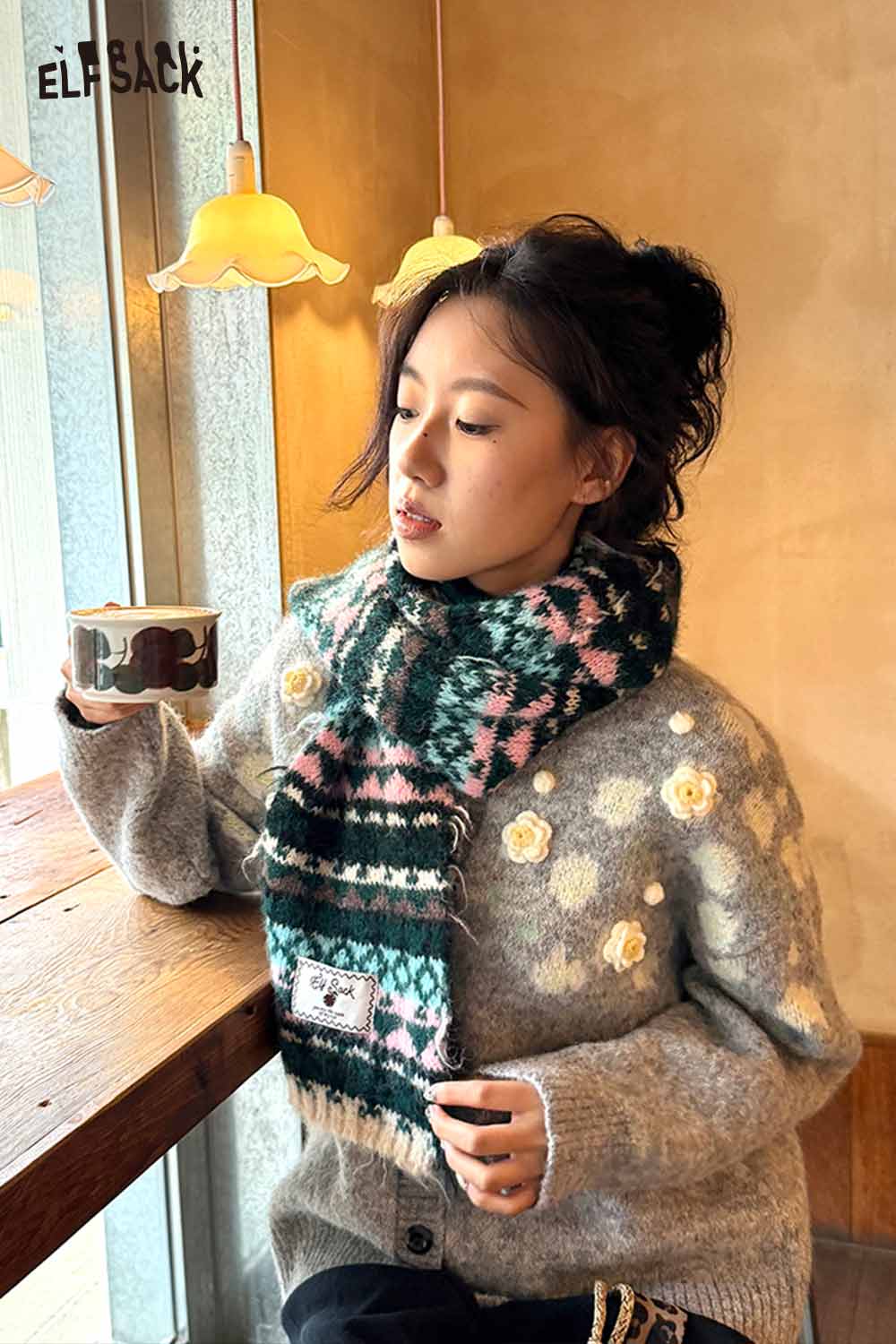 ELFSACK Bohemian Stripe Neck Warmer in Green and Pink Pattern, styled with a cozy sweater