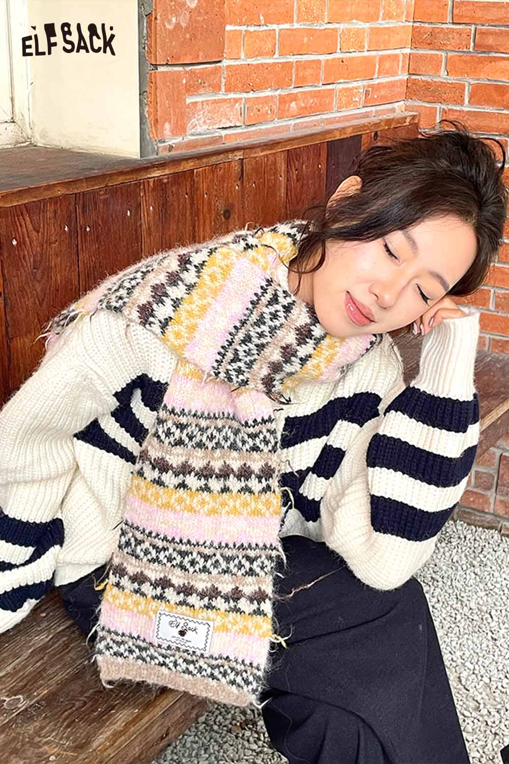 Stylish ELFSACK bohemian stripe neck warmer paired with a cozy sweater for a chic look