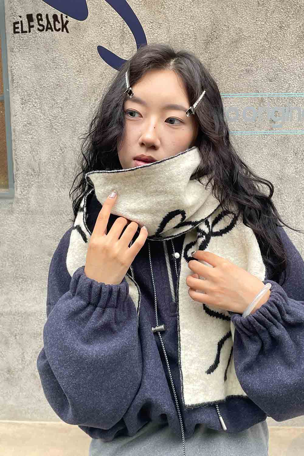 ELFSACK stylish bow graphic neck warmer in cream with black design, perfect for winter fashion
