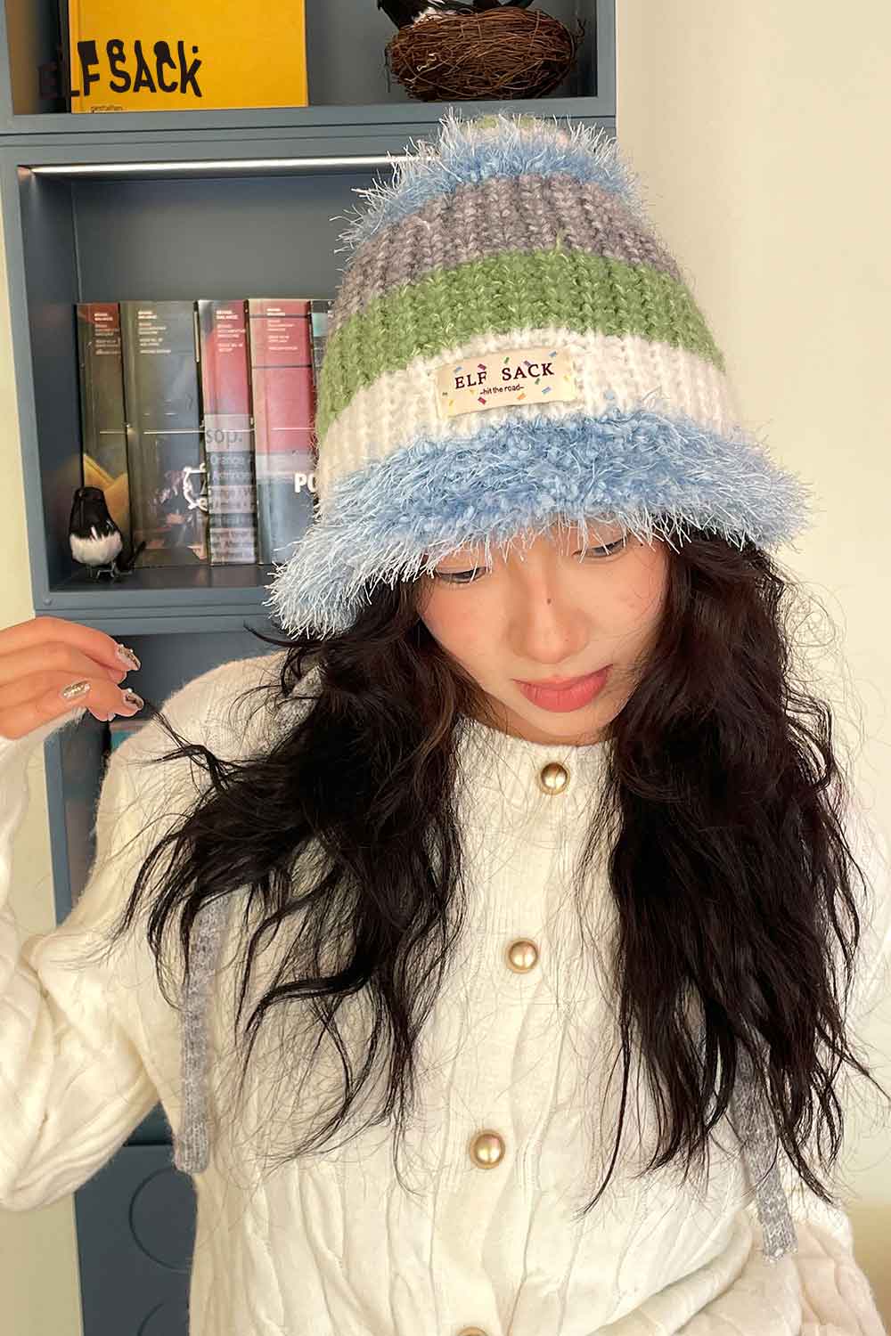 Color block knit bucket hat by ELFSACK featuring soft, multicolored stripes and cozy design