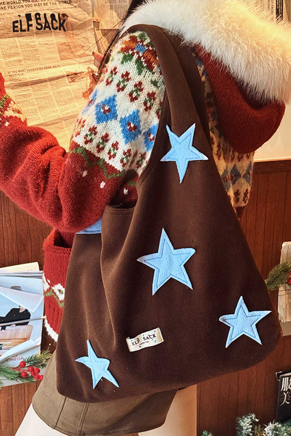 ELFSACK color block star tote bag with playful star appliques on a brown background