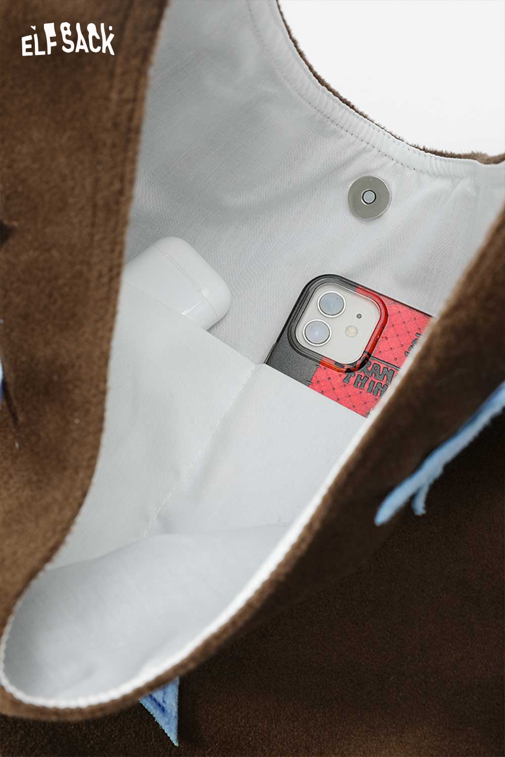 Interior view of ELFSACK color block star tote bag showing phone and pocket for essentials