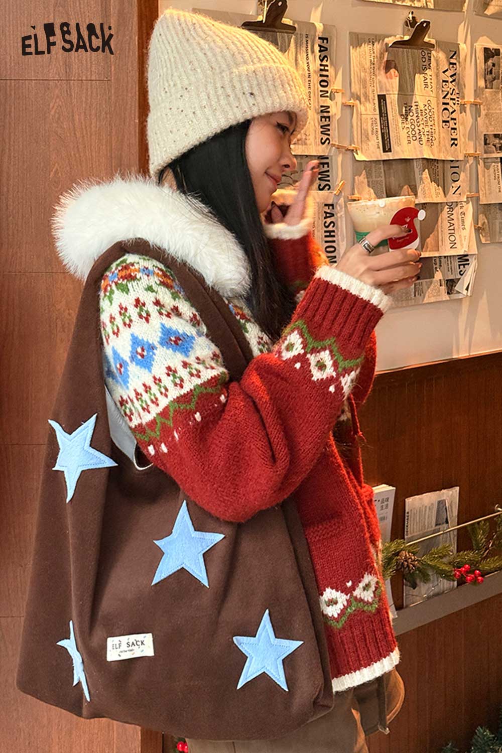 ELFSACK color block star tote bag made of soft fabric with decorative blue stars on a brown background