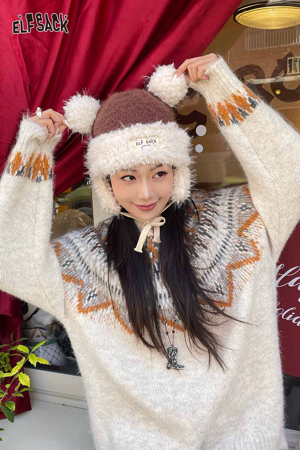 Cozy ELFSACK cute plush ear flap hat with pom poms, perfect for winter warmth and style