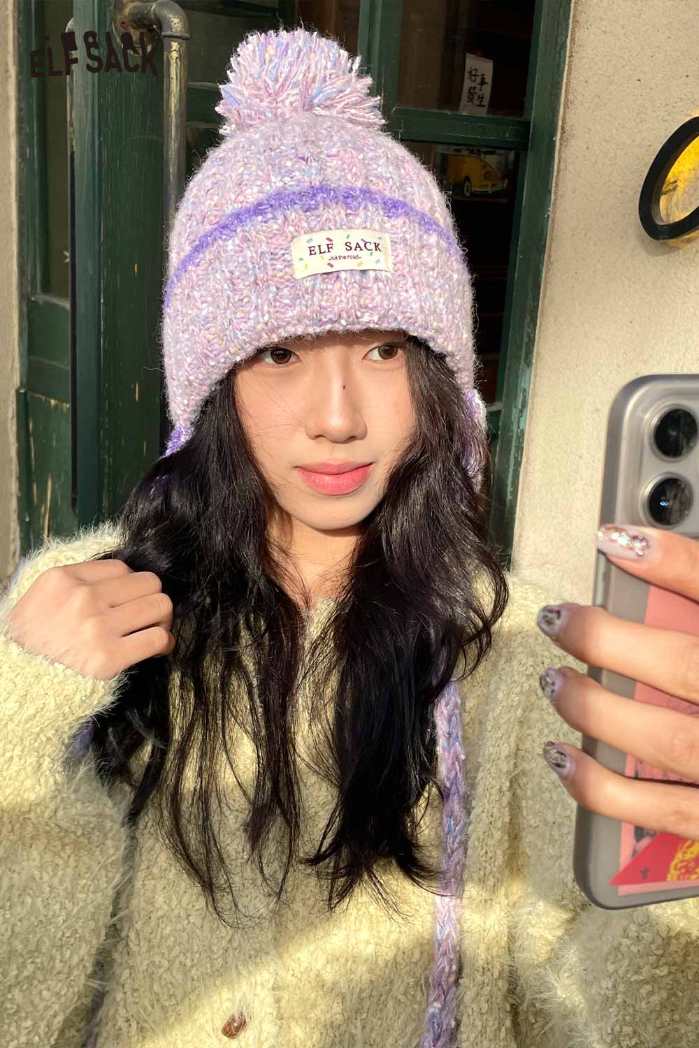 ELFSACK cute striped pom beanie for women in pastel colors, perfect for winter fashion