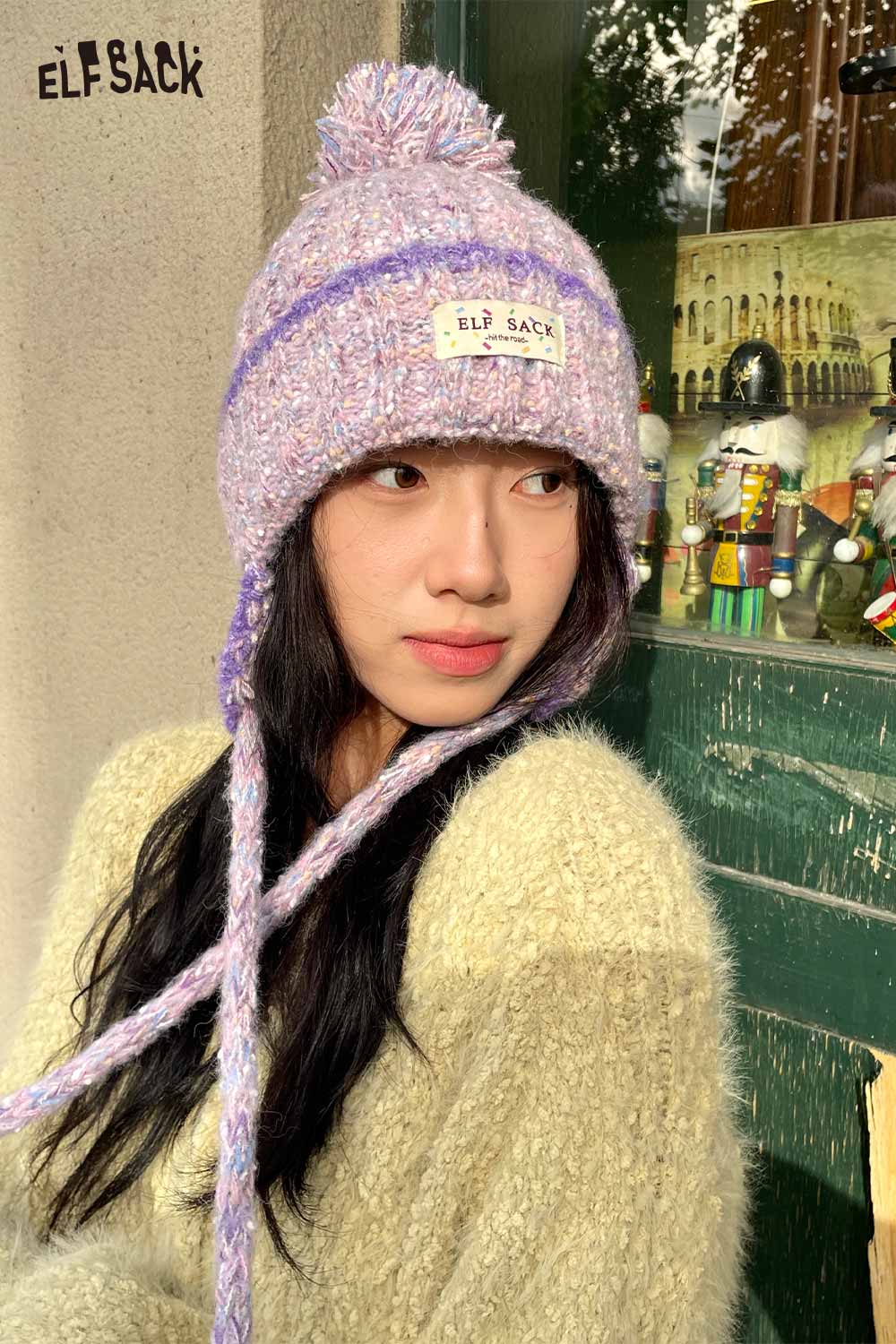 ELFSACK cute striped pom beanie for women in pastel colors with ties, perfect for winter fashion