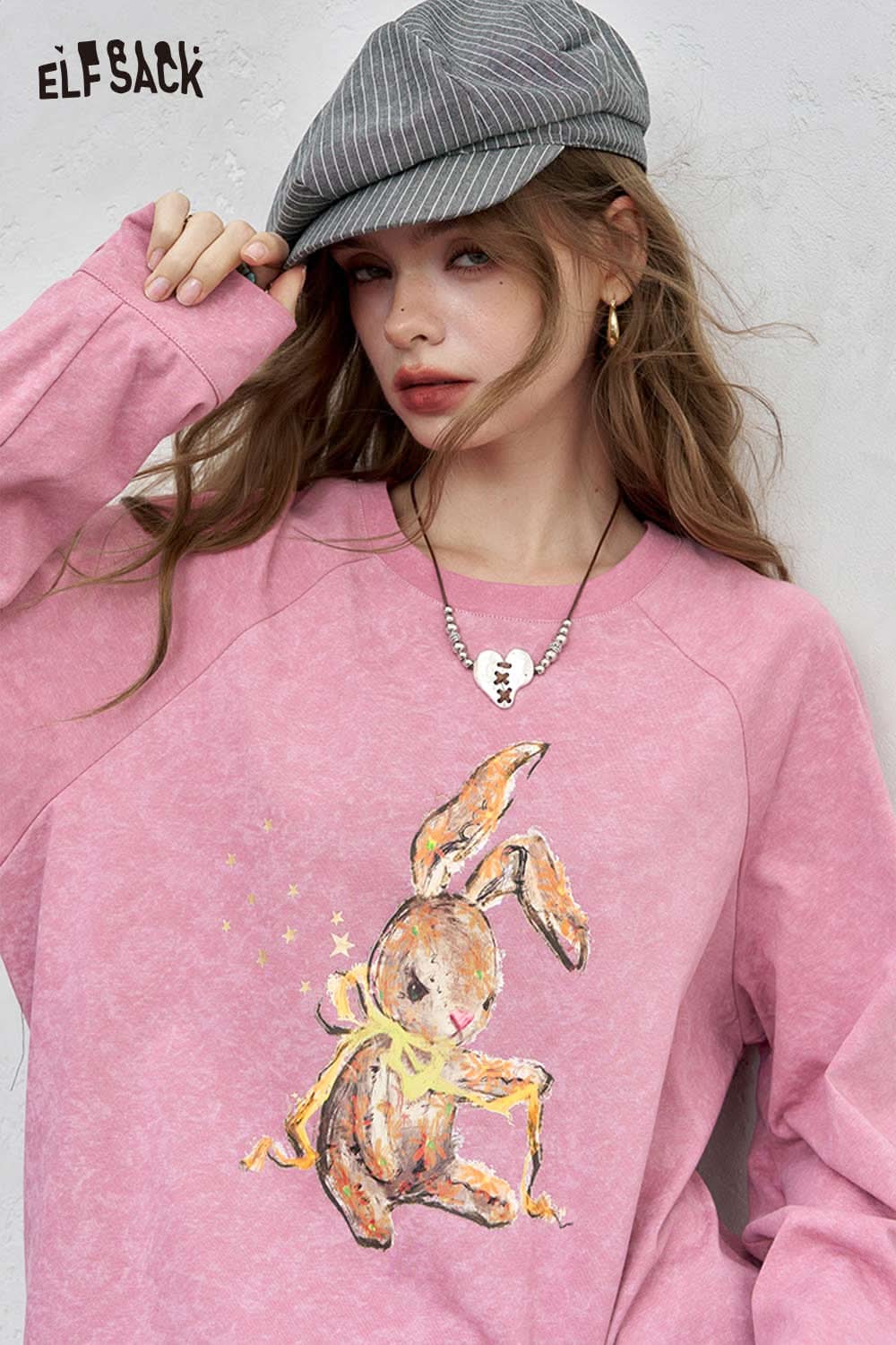 ELFSACK organic cotton embroidered long sleeve tee in pink featuring a playful rabbit design