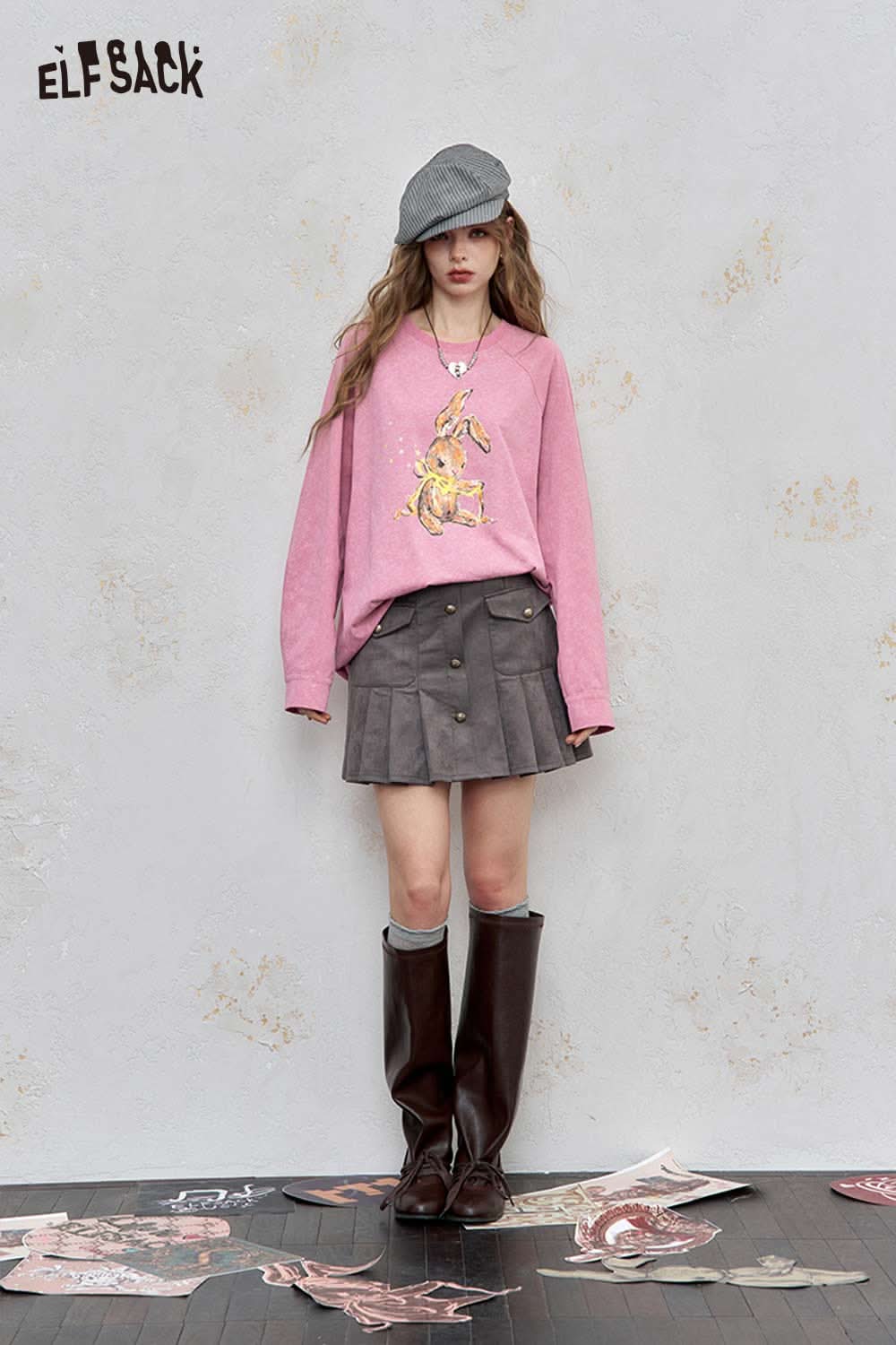 ELFSACK organic cotton embroidered long sleeve tee in pink, styled with a skirt and boots for a trendy look