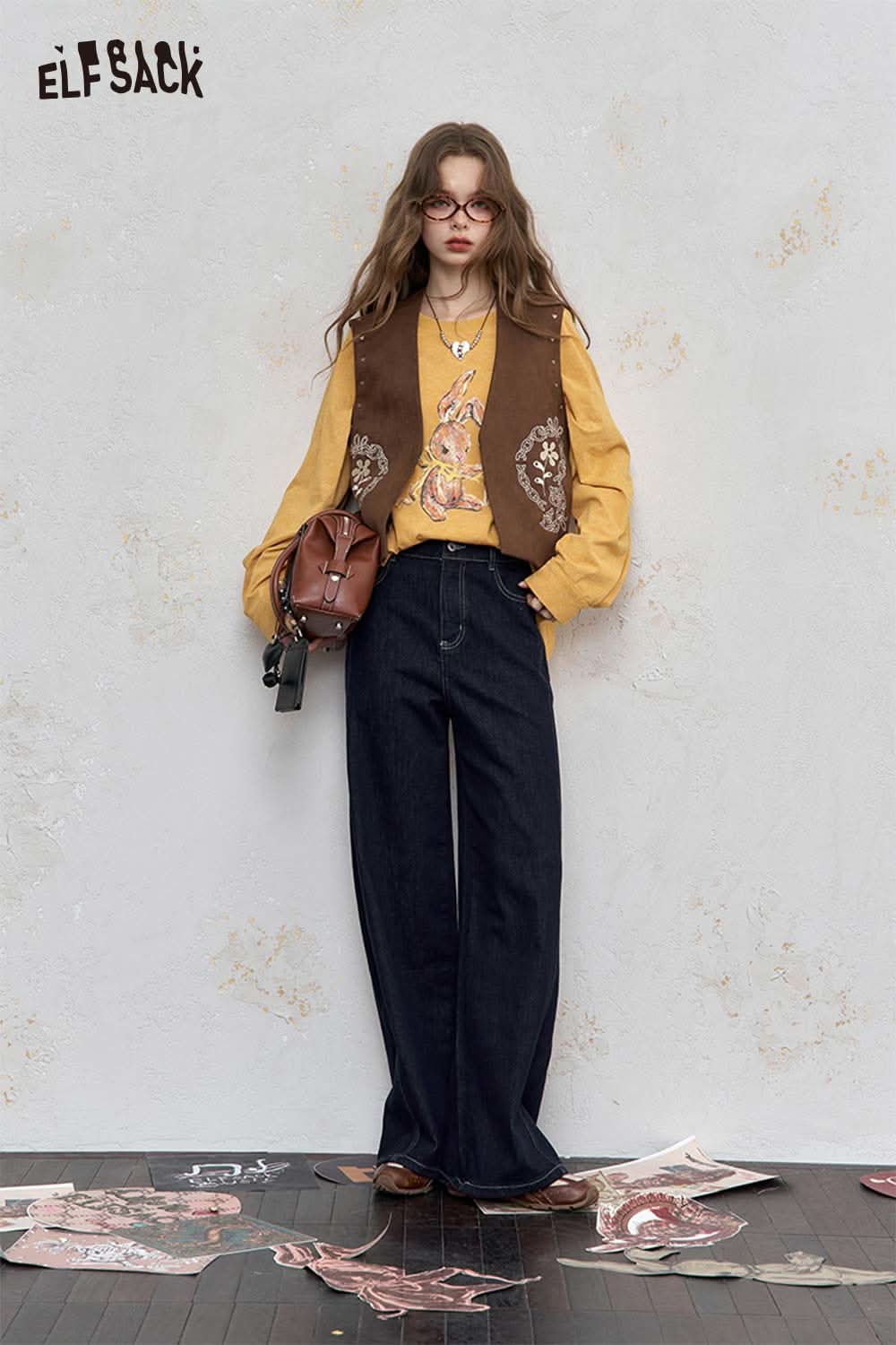 ELFSACK organic cotton embroidered long sleeve tee in yellow paired with a stylish vest and wide-leg pants