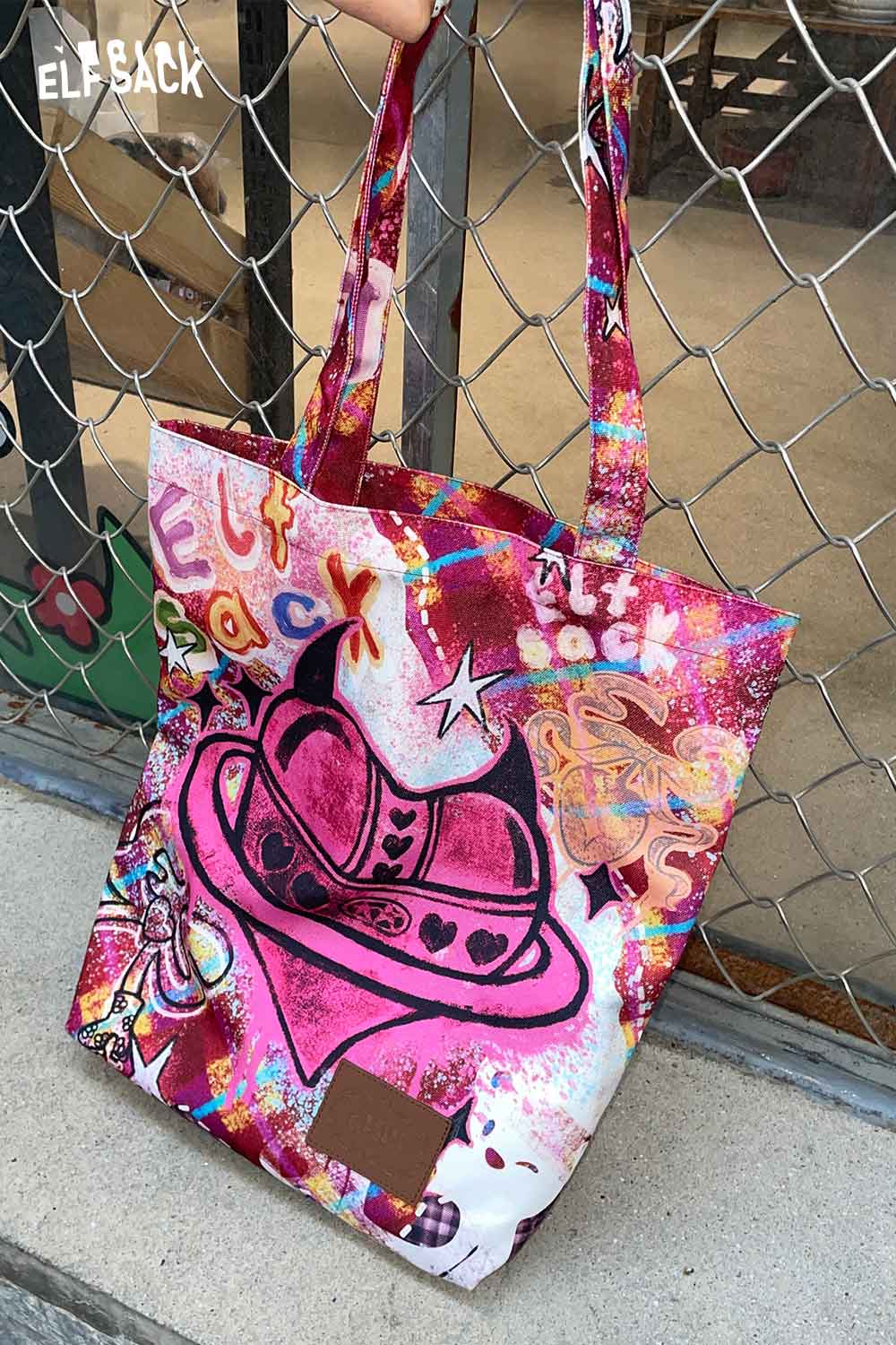 ELFSACK plaid graffiti tote bag featuring vibrant colors and unique artwork for stylish everyday use