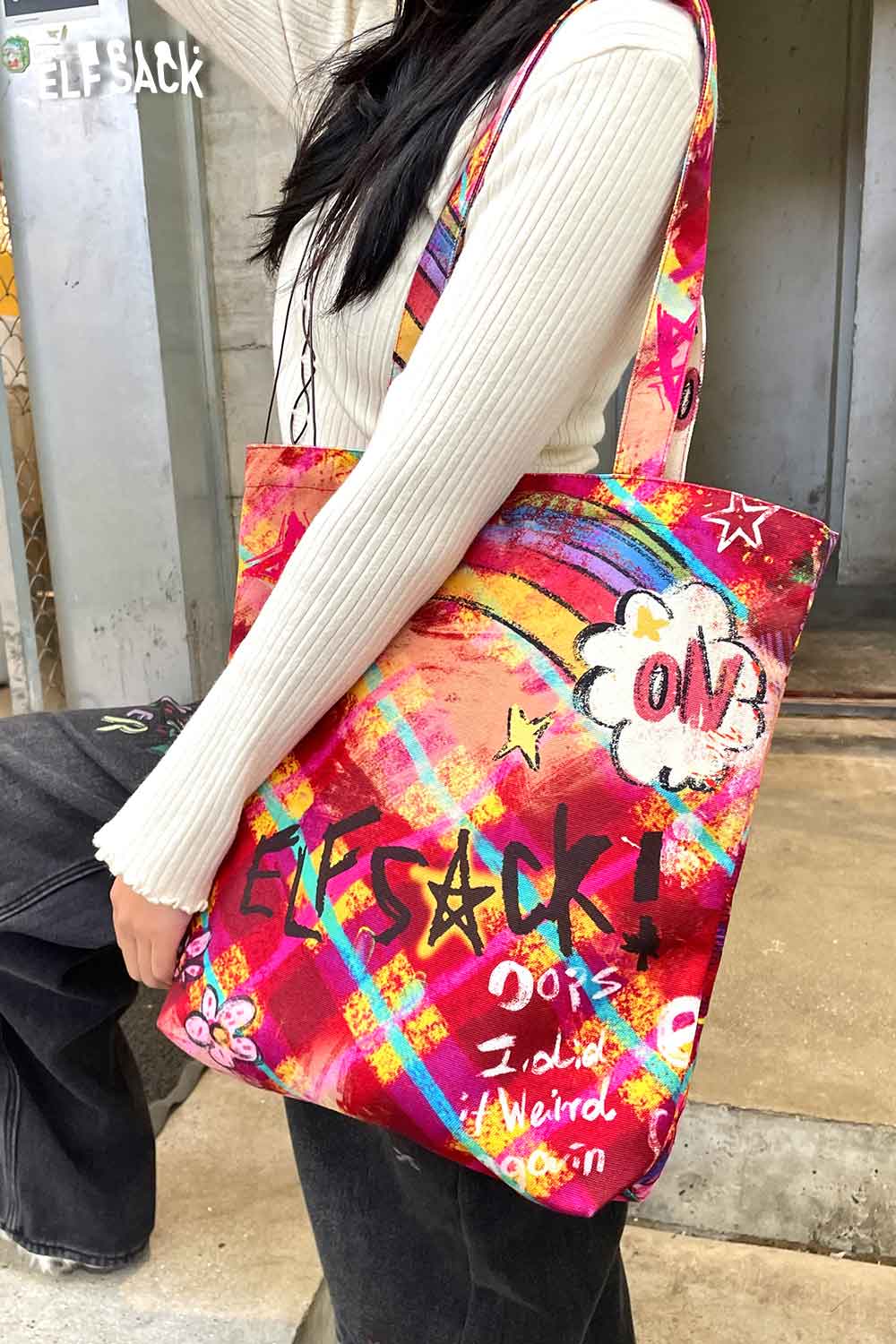 Colorful ELFSACK plaid graffiti tote bag featuring vibrant designs and playful graphics