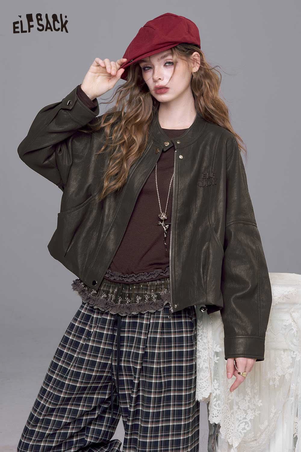 ELFSACK PU leather batwing sleeve jacket in dark color, styled with a casual outfit and accessories
