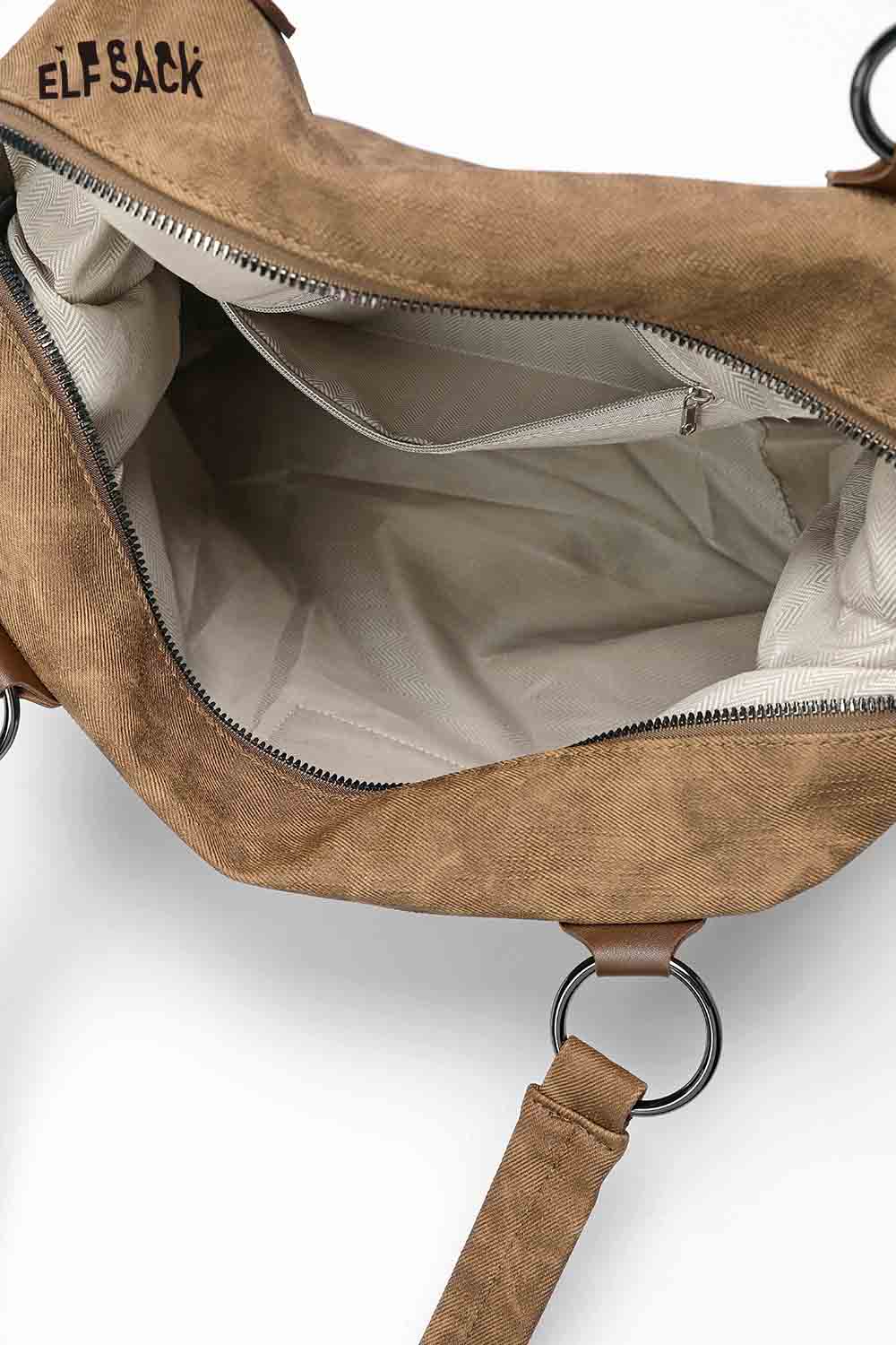 Inside view of ELFSACK punk studded tote bag for women with spacious compartments and zipper pocket