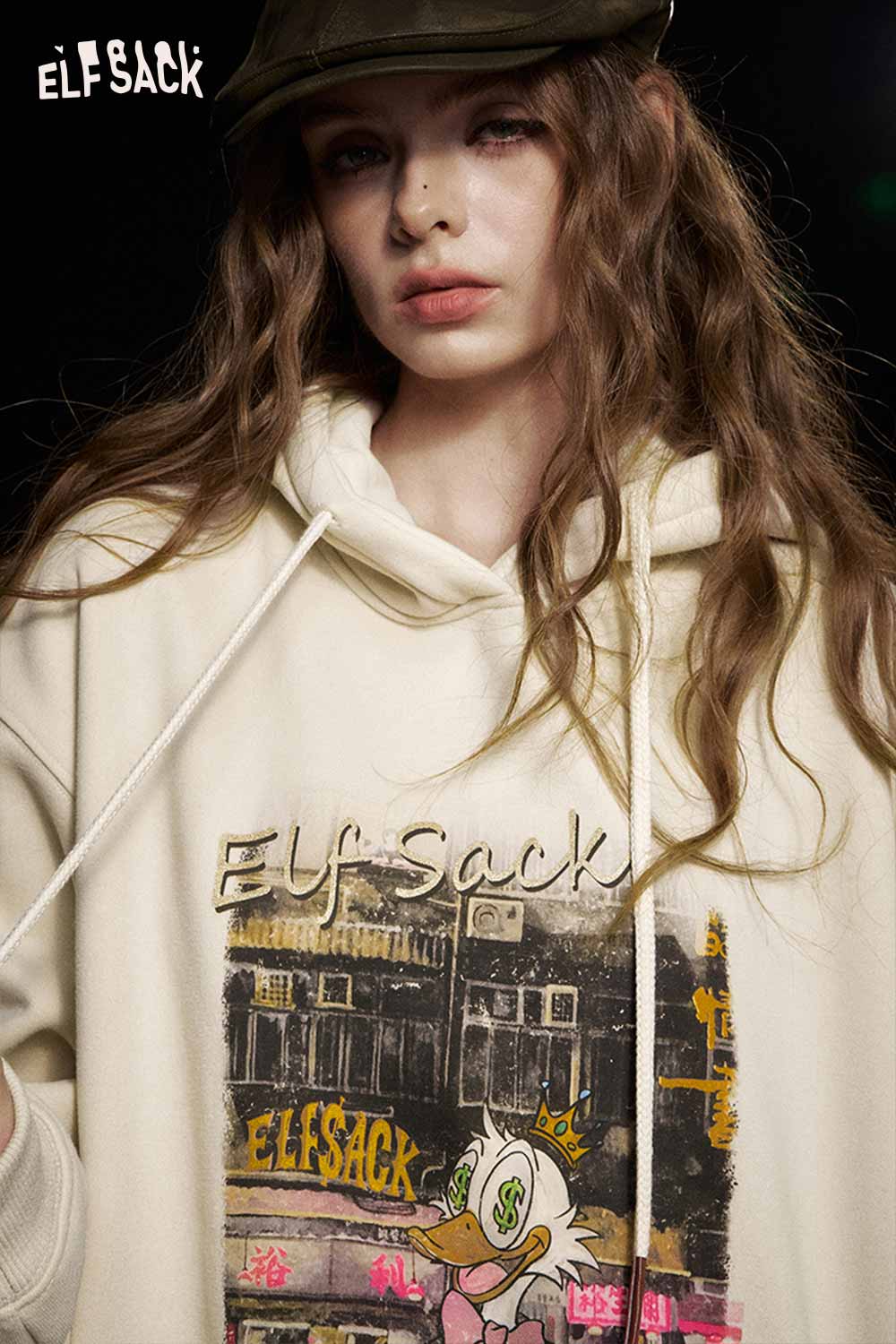 ELFSACK soft graphic hooded sweatshirt in cream with artistic design and relaxed fit