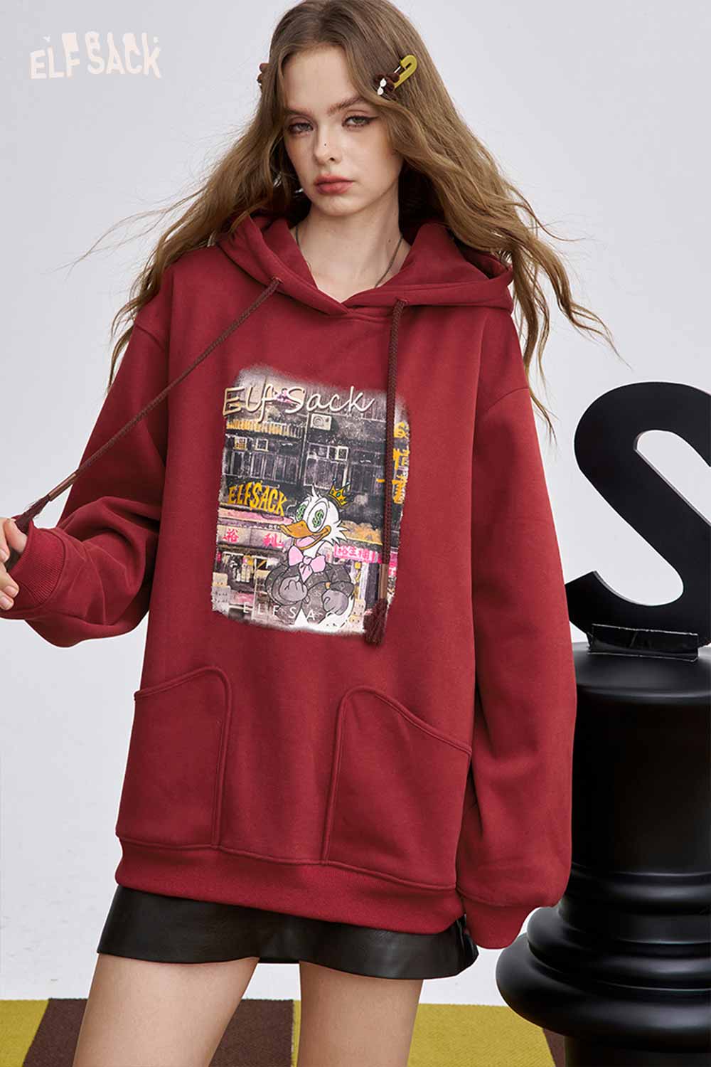ELFSACK soft graphic hooded sweatshirt in burgundy with front pocket and vibrant print design