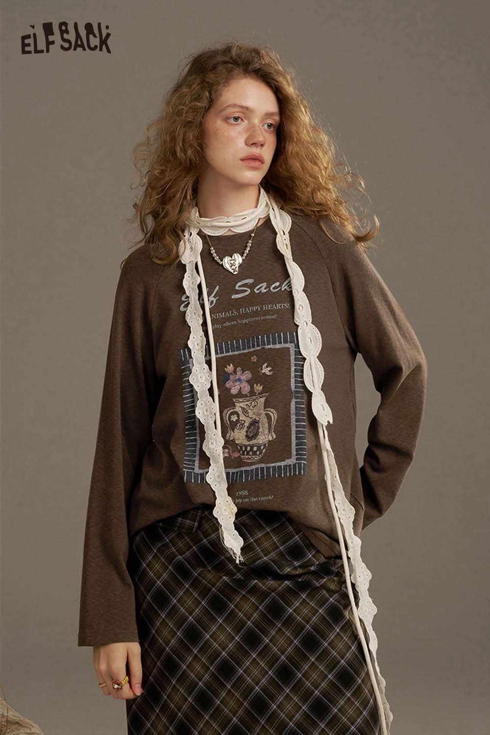 ELFSACK soft printed raglan sleeve sweatshirt in brown with unique graphic design and relaxed fit