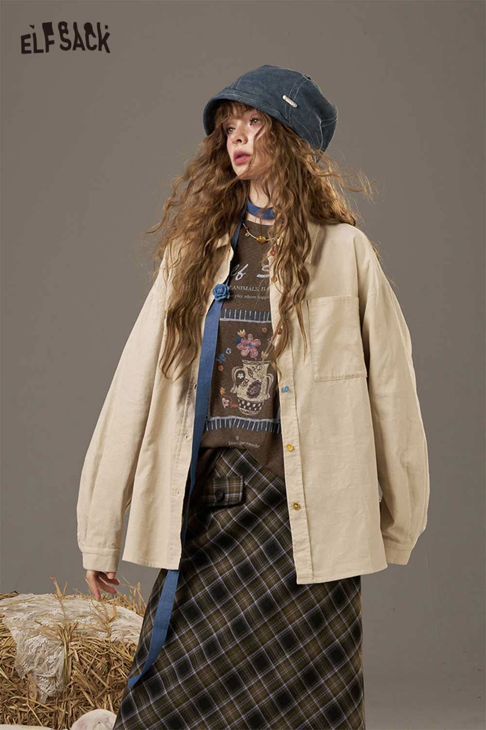 ELFSACK soft printed raglan sleeve sweatshirt in a stylish layered outfit with a hat