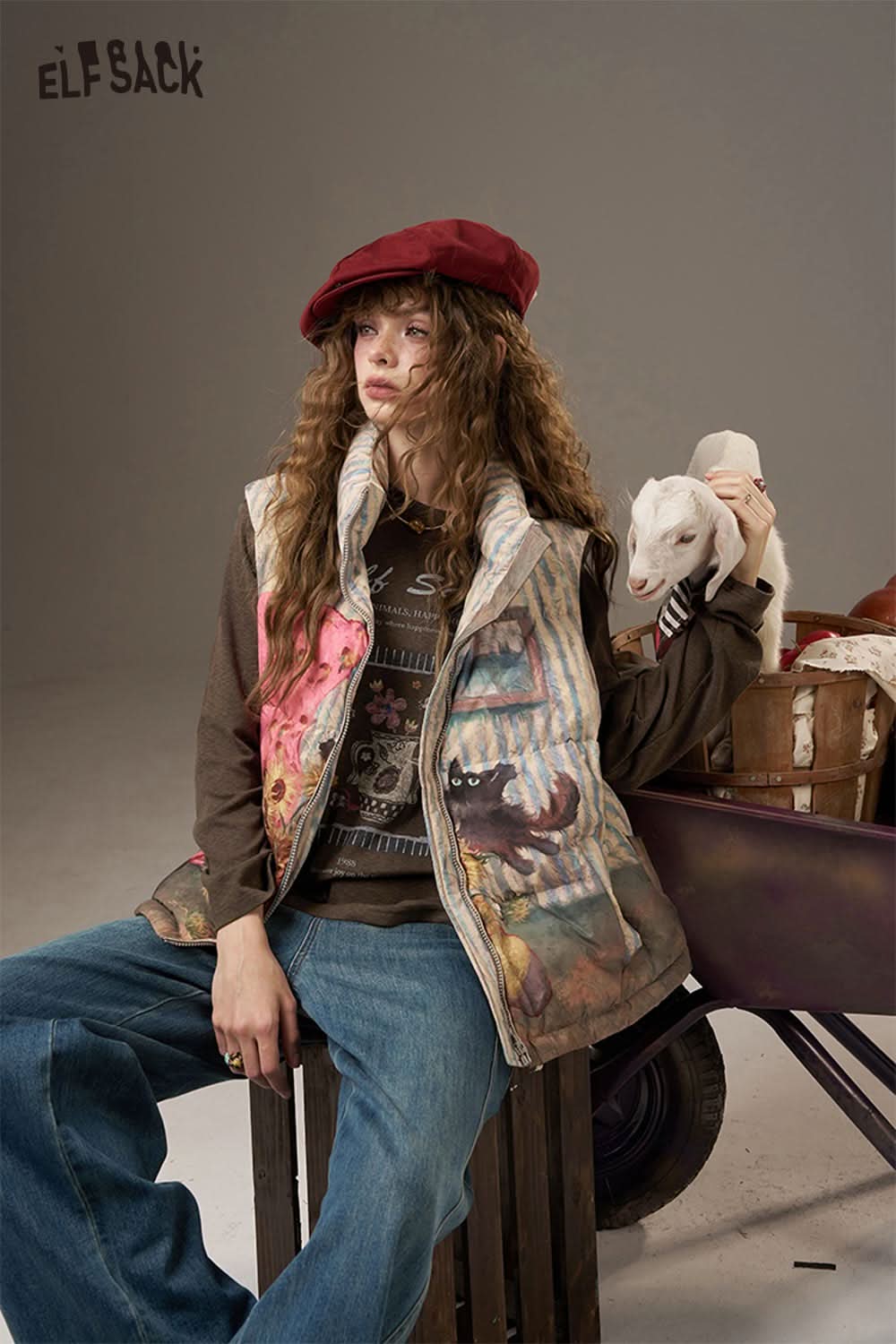 ELFSACK soft printed raglan sleeve sweatshirt with unique floral design, styled with casual denim and a vest