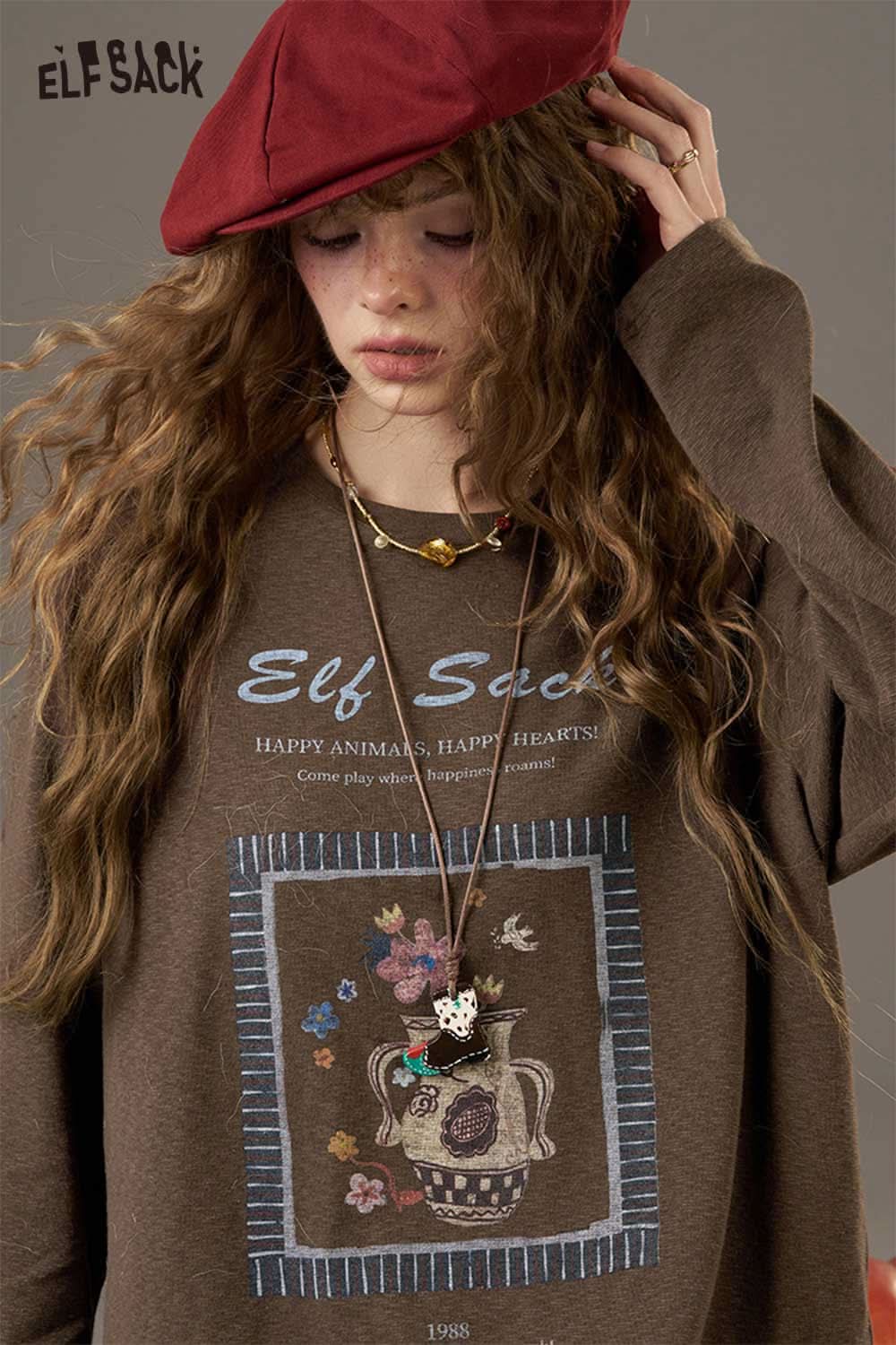 ELFSACK soft printed raglan sleeve sweatshirt featuring a floral design and relaxed fit for casual wear