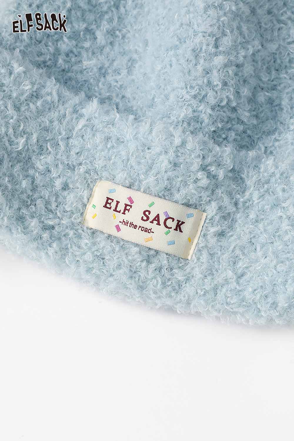 Soft blue ELFSACK beanie featuring a white plush ear muff beanie design for winter warmth