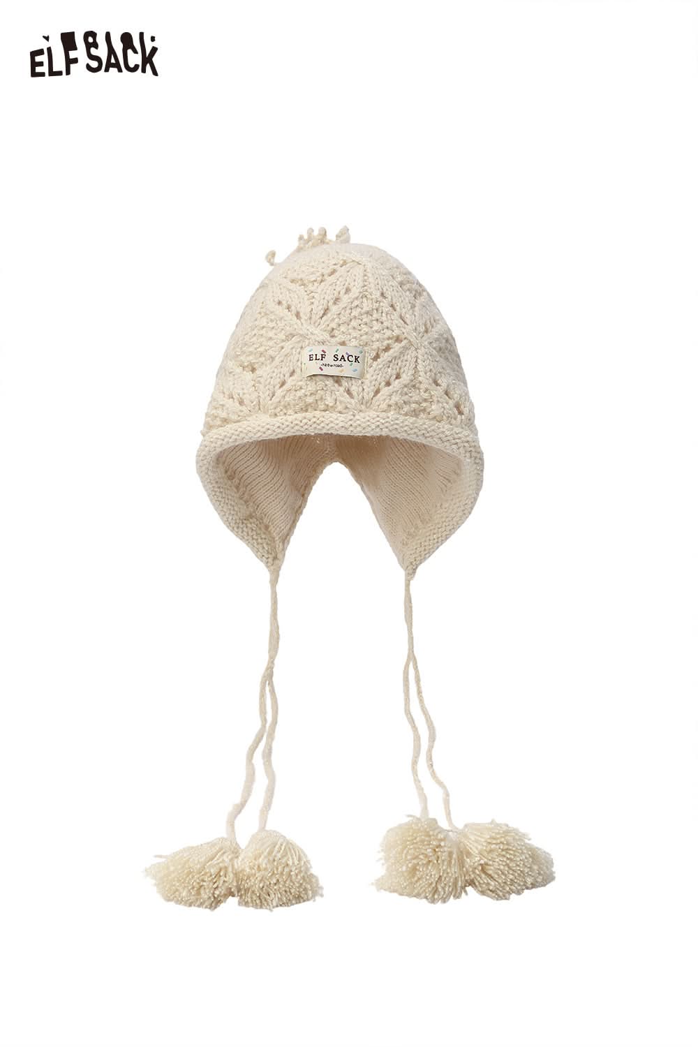ELFSACK women's braided tassel bucket hat in cream with decorative pom poms and knitted design