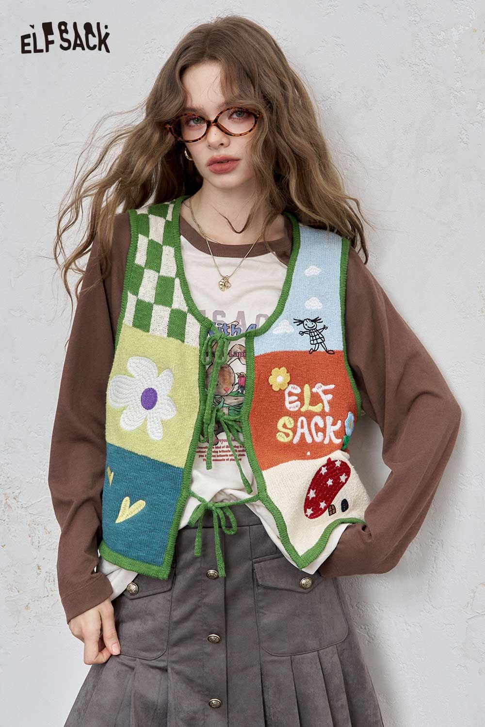 ELFSACK women's graphic applique vest with colorful patches and playful designs for a trendy look