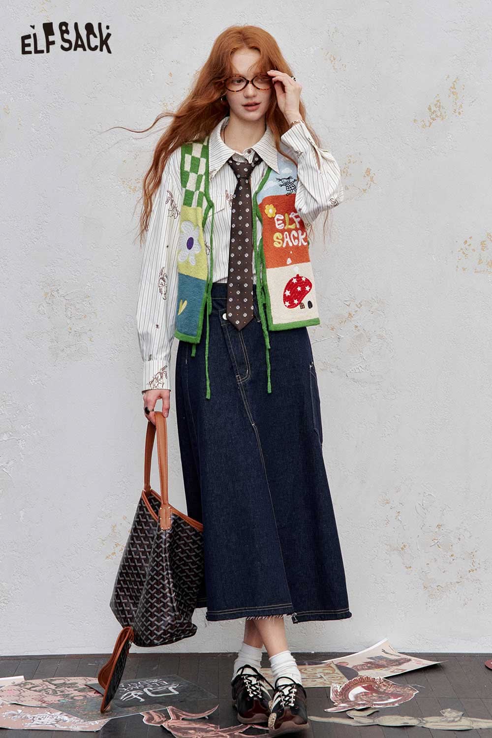 Stylish women's graphic applique vest by ELFSACK, paired with a striped shirt and denim skirt