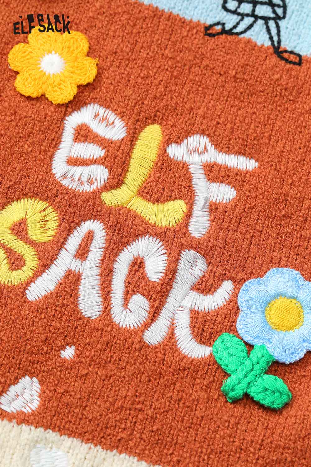 Close-up of ELFSACK women's graphic applique vest showcasing colorful floral embroidery details.