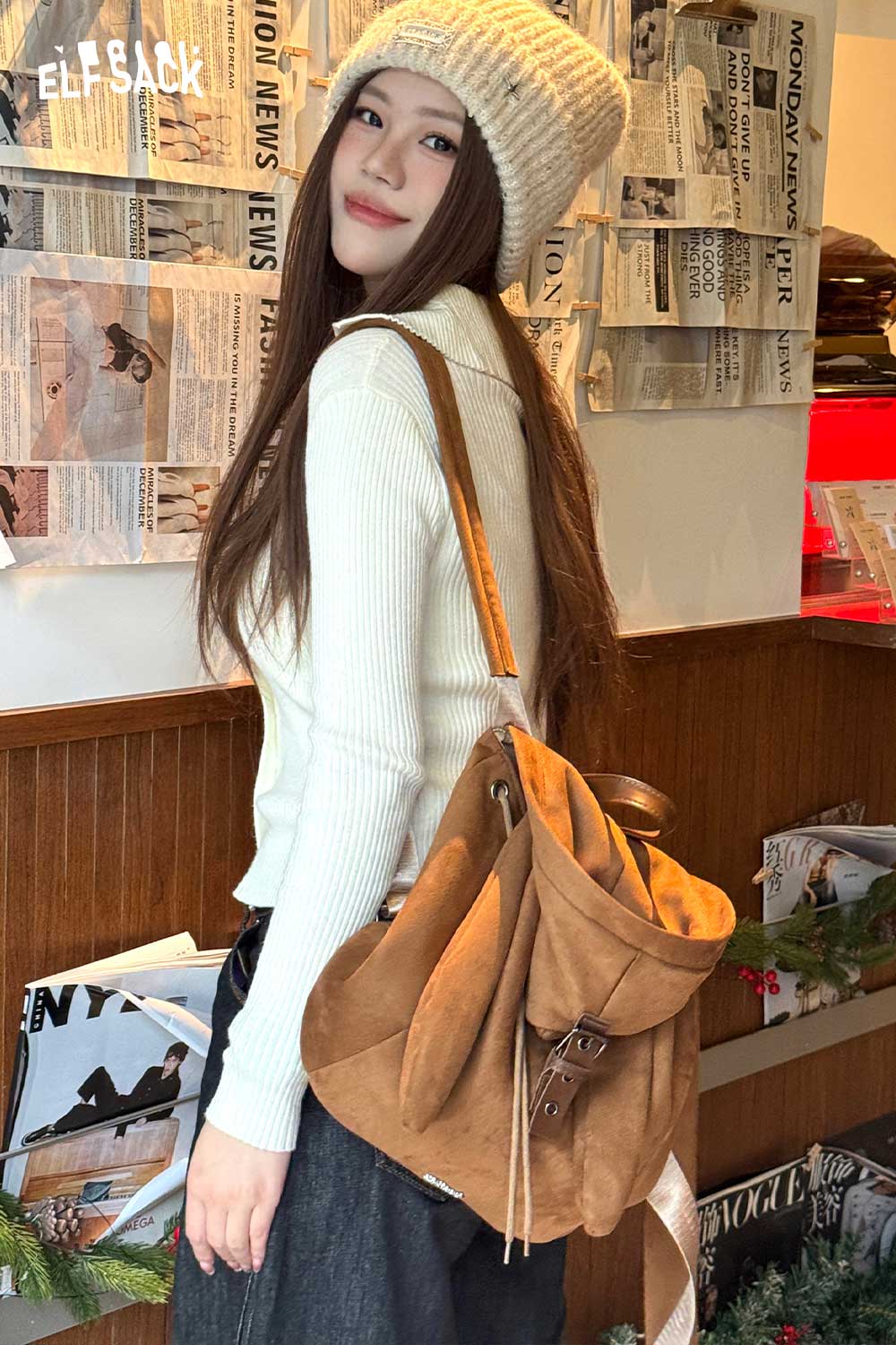 Stylish ELFSACK bunny ear backpack for women in brown suede, perfect for casual outings