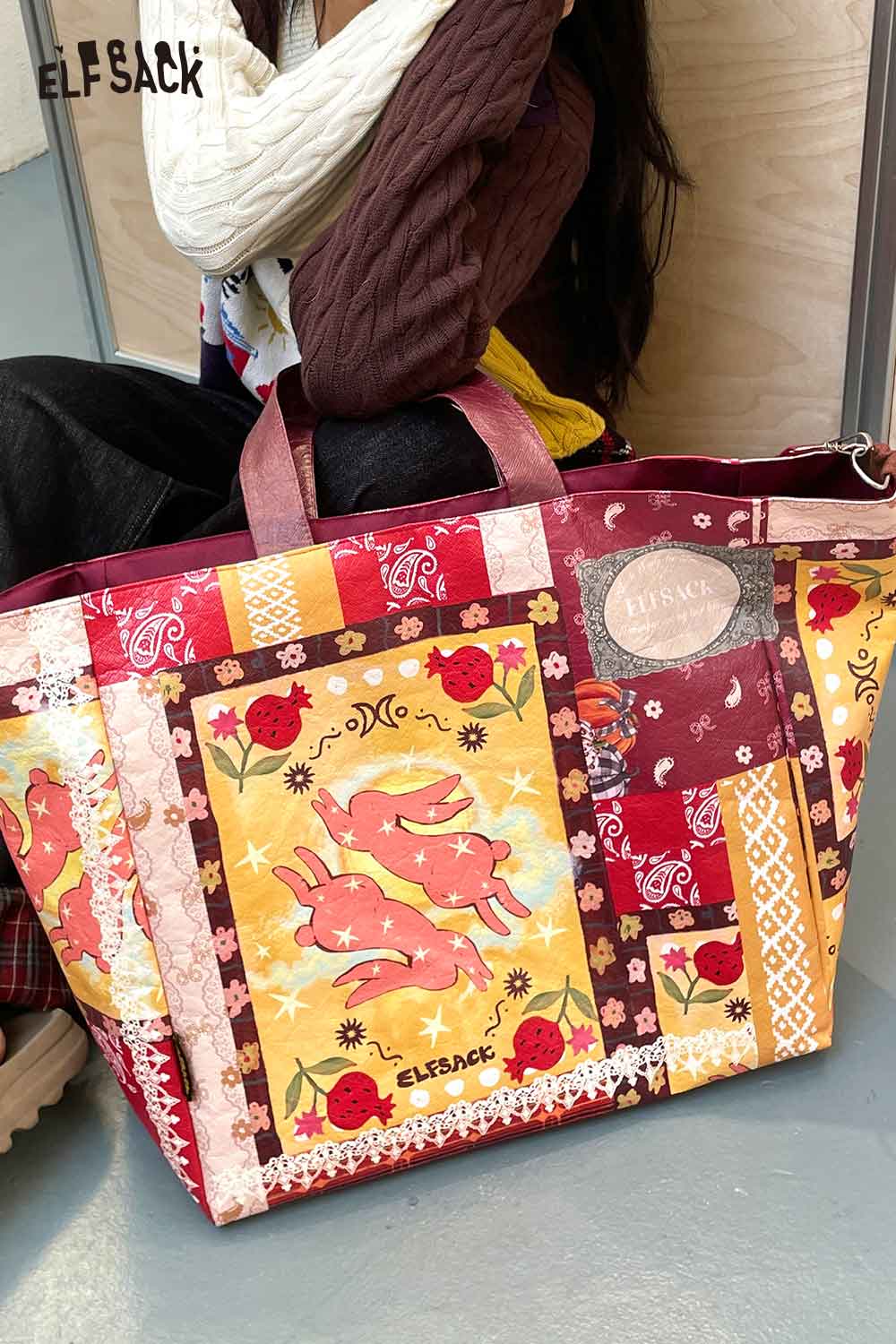 Colorful ELFSACK bohemian rabbit print shoulder bag featuring flowers and vibrant patterns