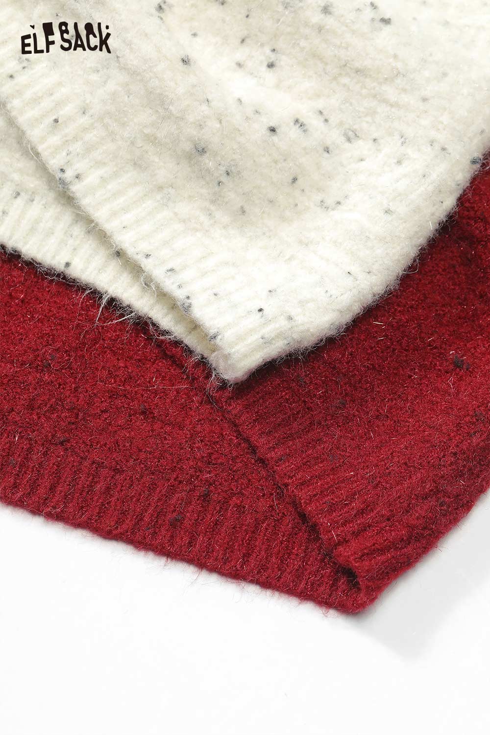 Close-up of ELFSACK bow embellished cutout sweater showcasing textured knit fabric in cream and burgundy