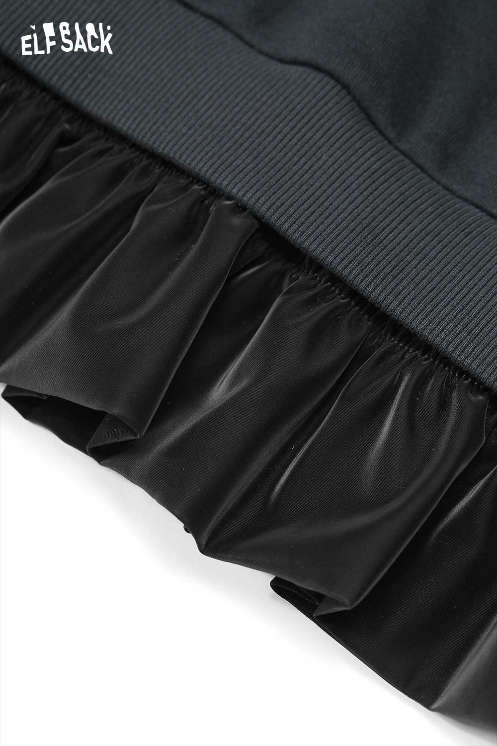 Close-up of ELFSACK cherry embroidery dress featuring a ruffled hem for a stylish look