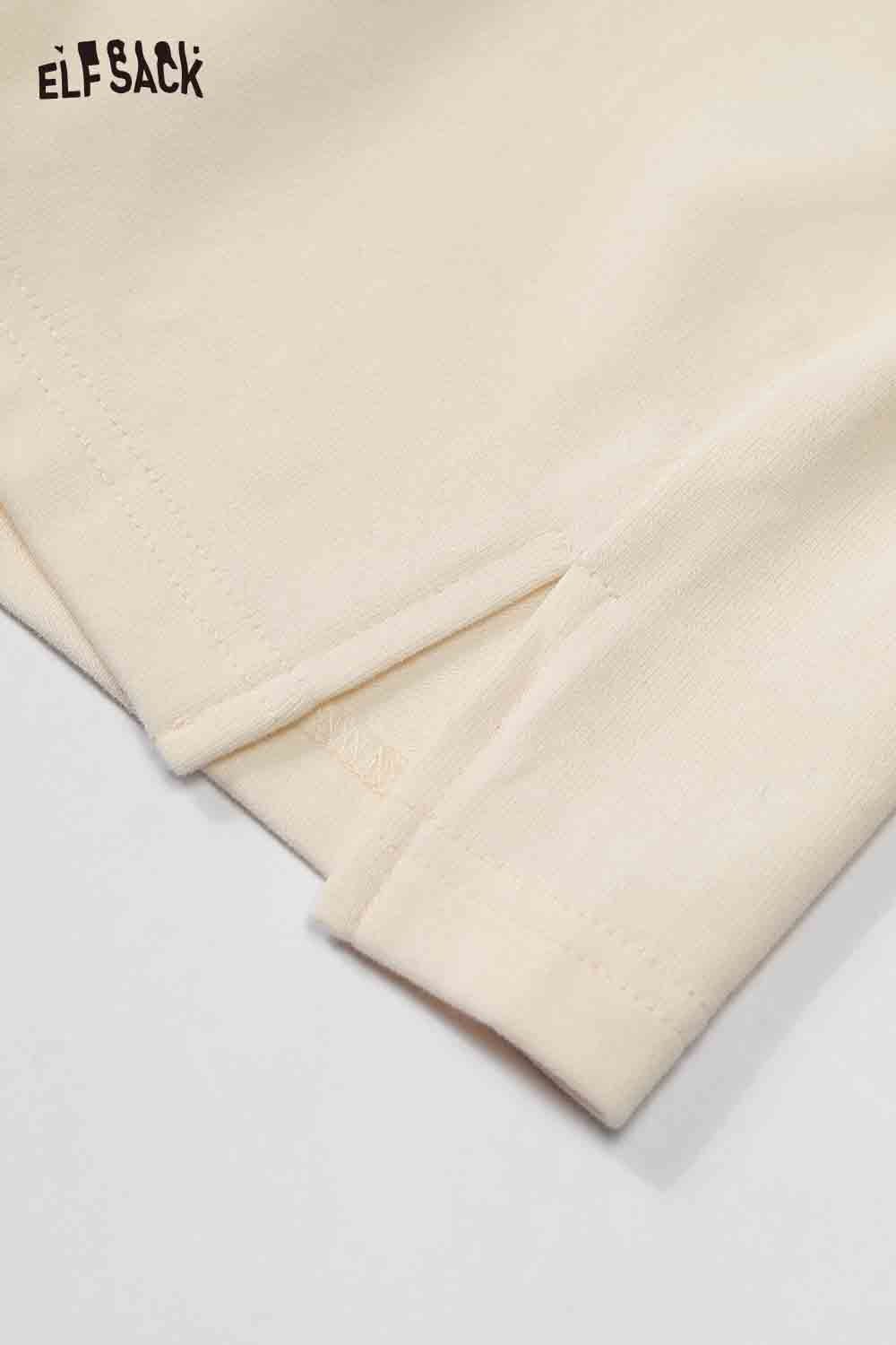 Close-up of ELFSACK color block raglan sleeve tshirt showcasing breathable fabric and stylish design.