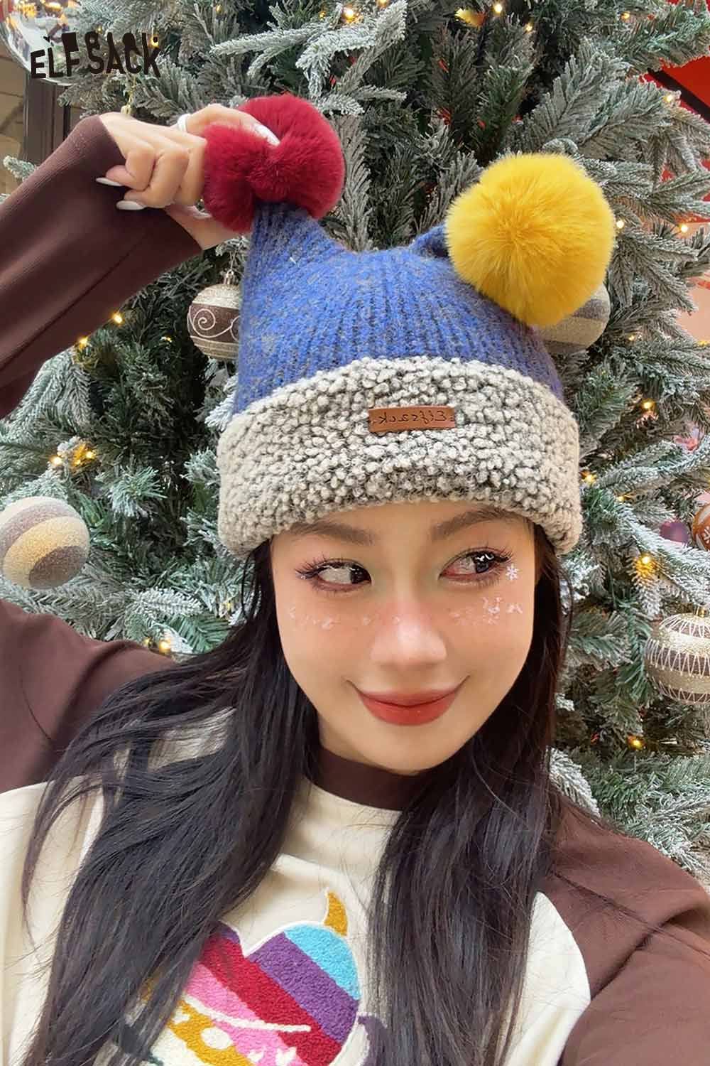 ELFSACK colorful pom pom knit beanie featuring vibrant pom poms and a cozy design, perfect for winter fashion.